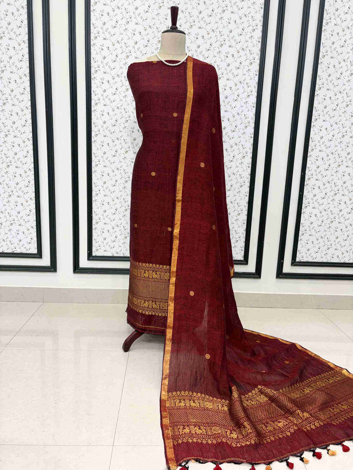Deep maroon jaishree linen unstitched 2-piece suit full front view with zari woven dupatta draped on mannequin
