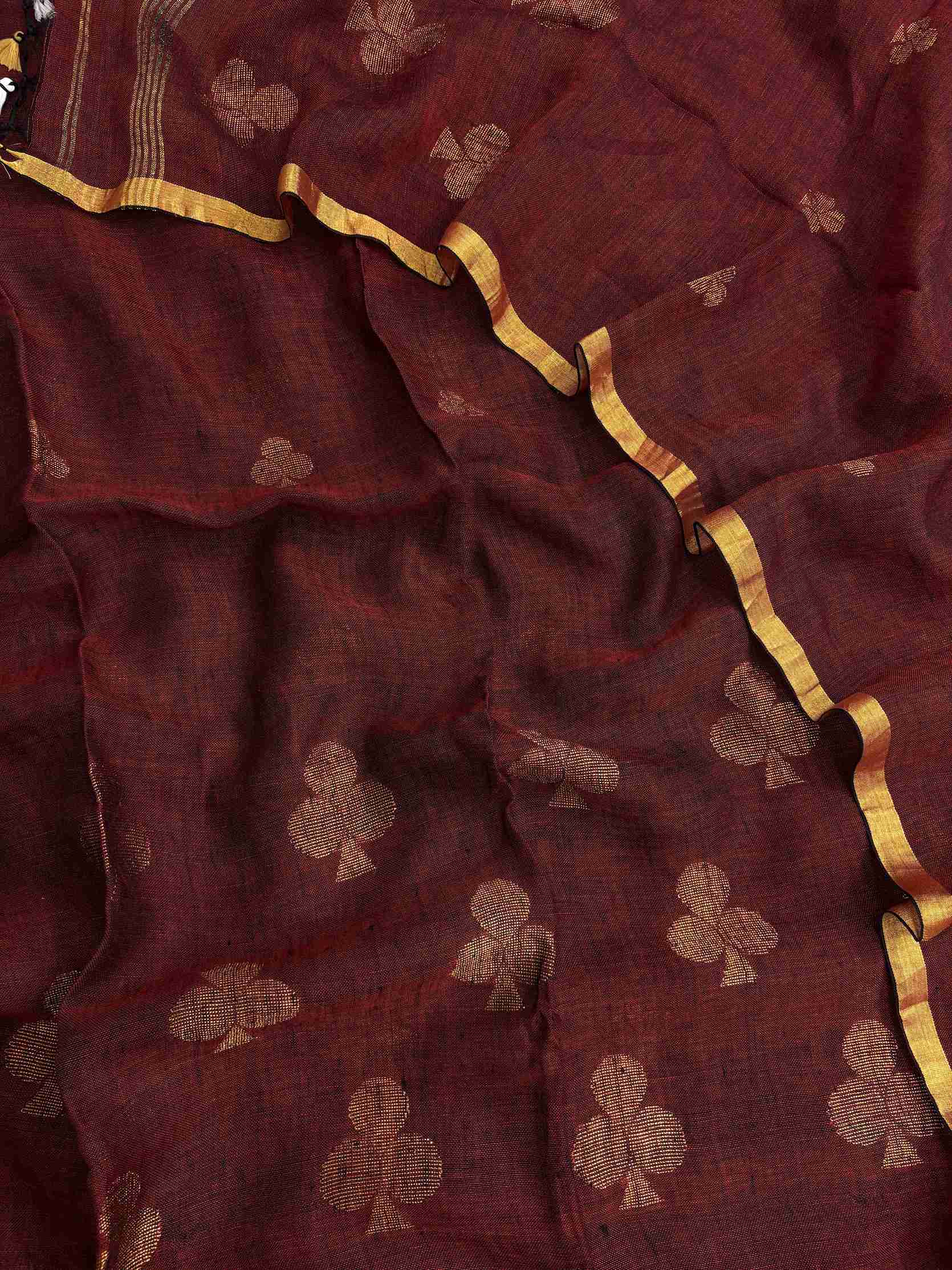 Scattered golden geometric spade woven motifs across deep red pure handloom linen dupatta surface