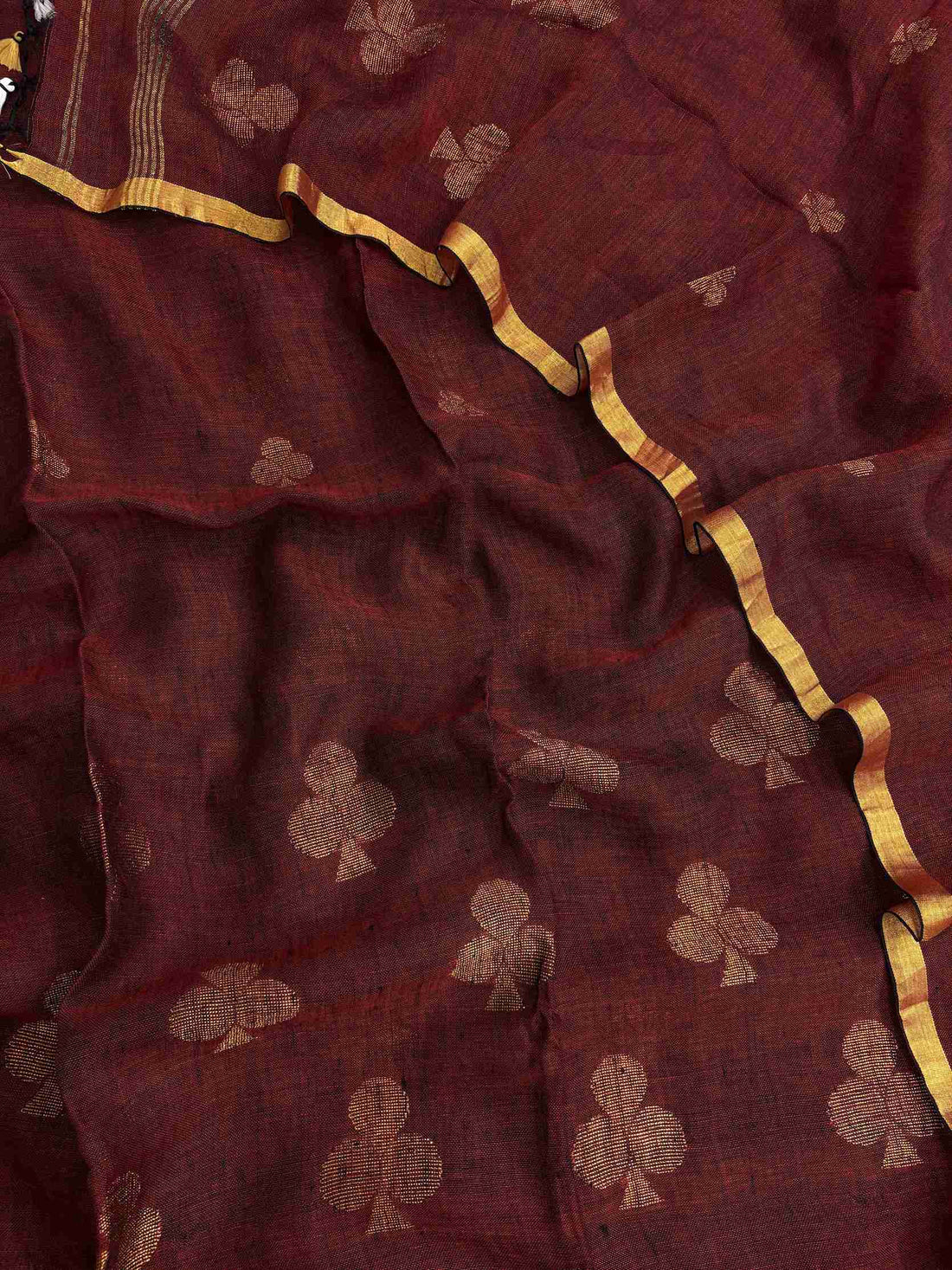 Scattered golden geometric spade woven motifs across deep red pure handloom linen dupatta surface