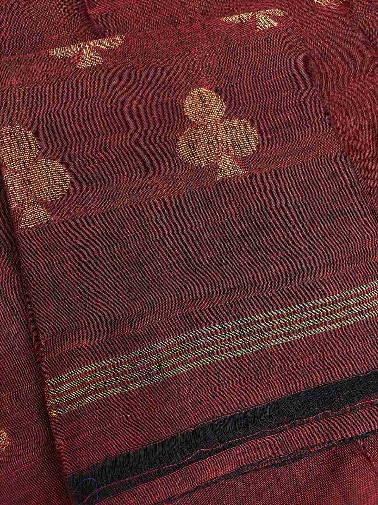 Natural slub texture and organic weave of deep red pure handloom linen shirt fabric close-up