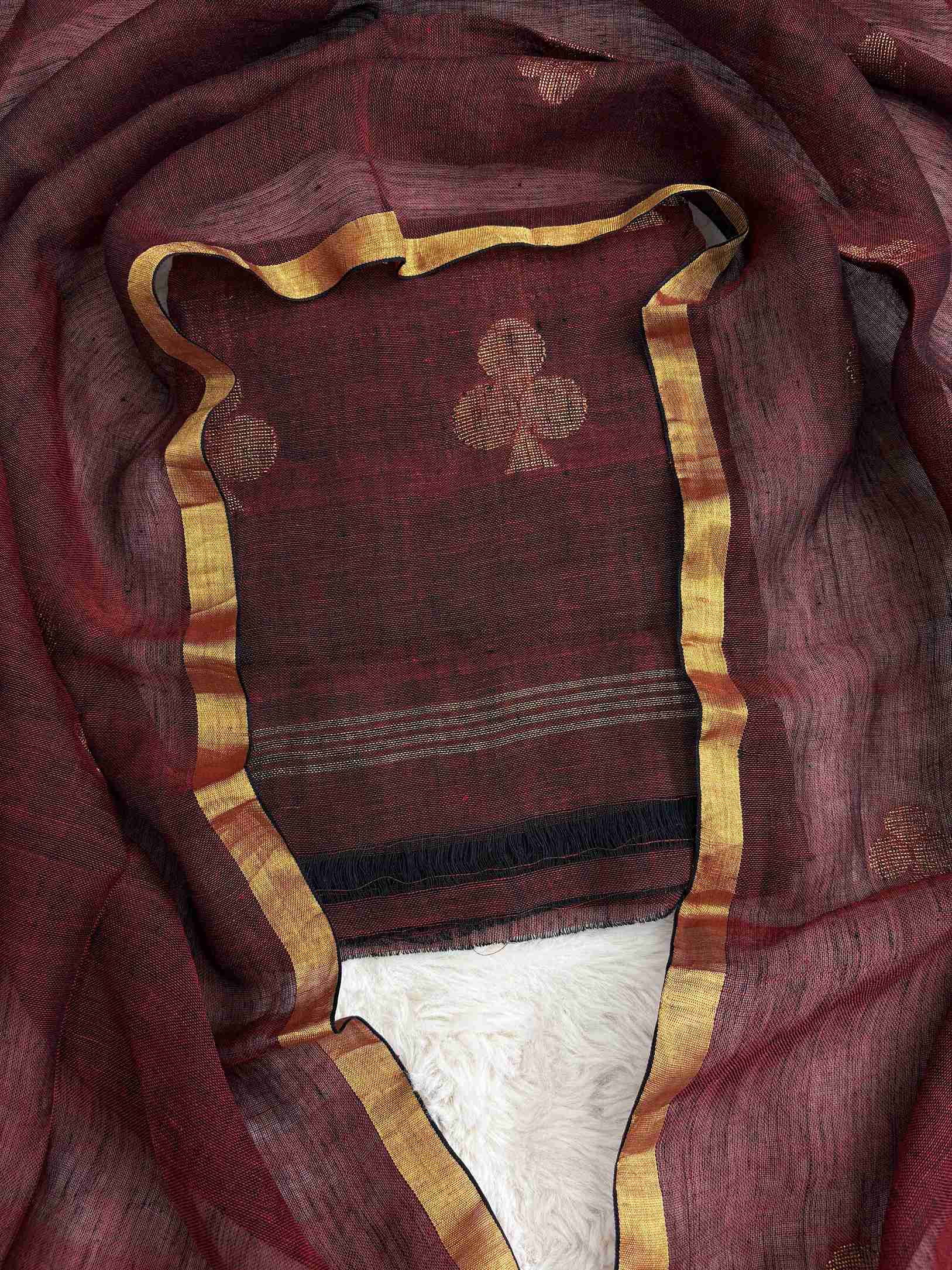 Scattered golden geometric spade woven motifs across deep-red pure handloom linen shirt body