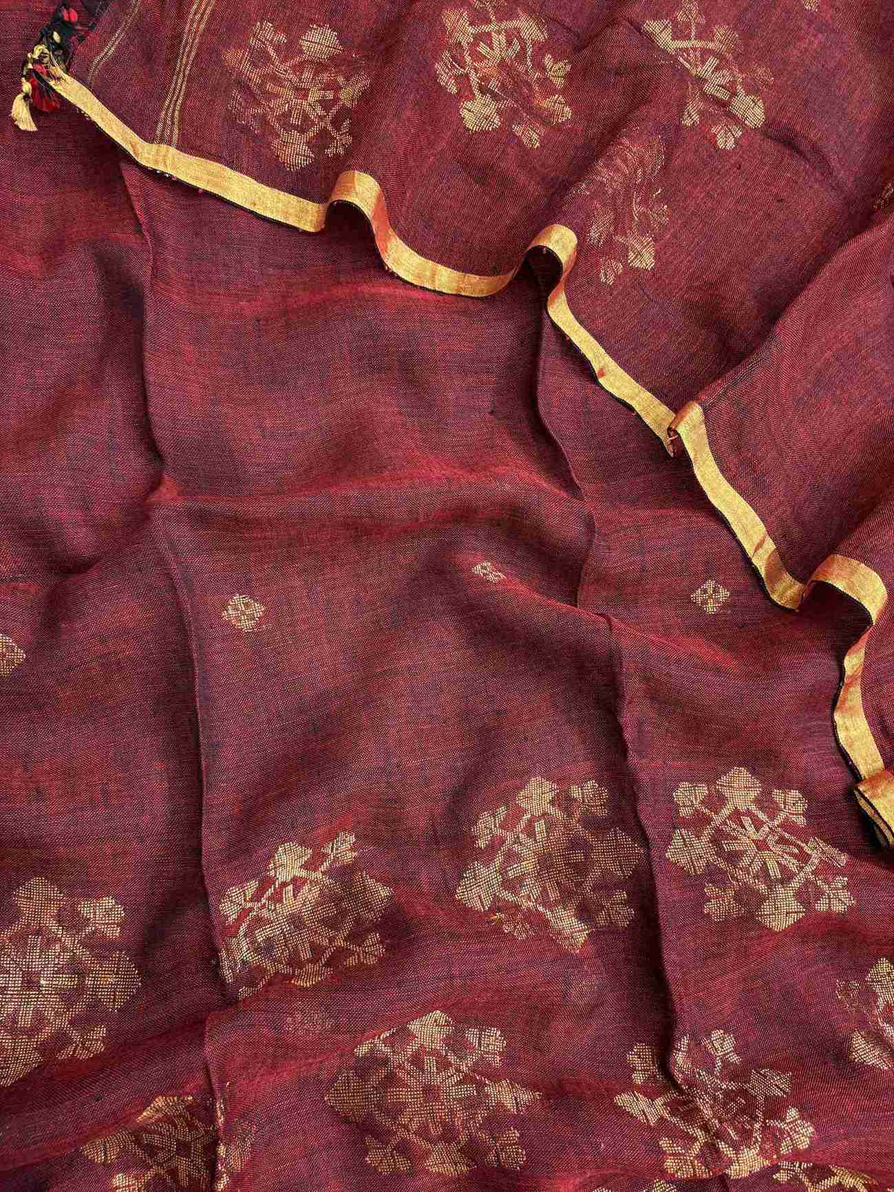 Scattered golden woven floral cluster motifs across deep wine pure handloom linen dupatta surface