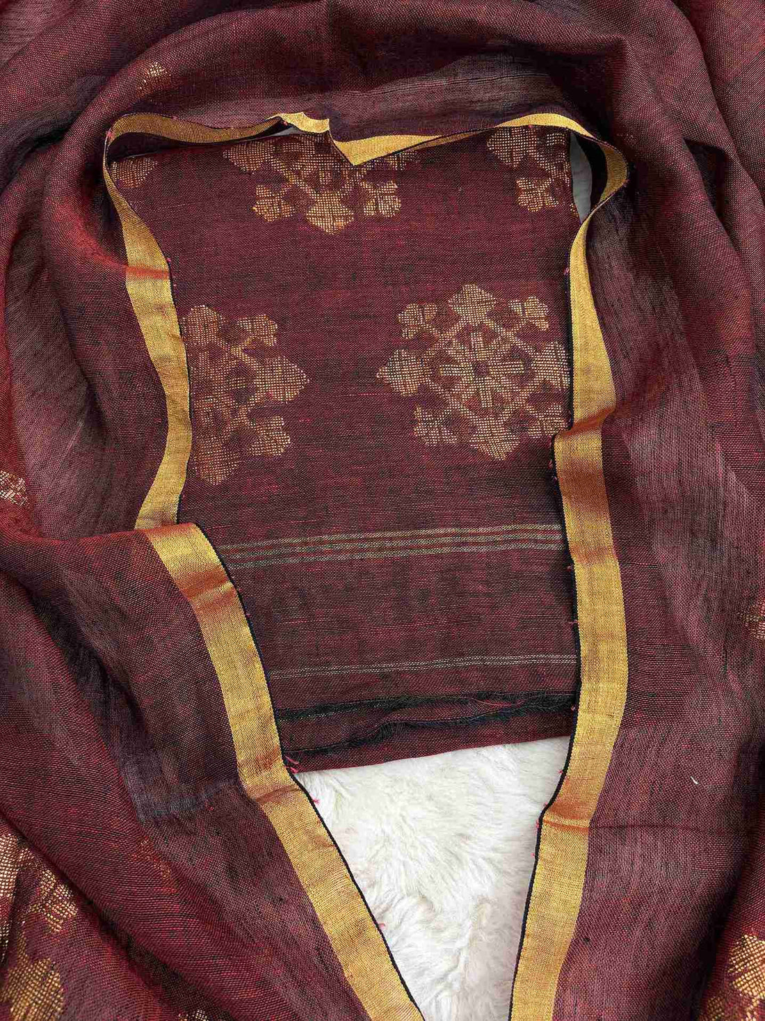 Natural slub texture and organic weave of deep wine pure handloom linen shirt fabric close-up