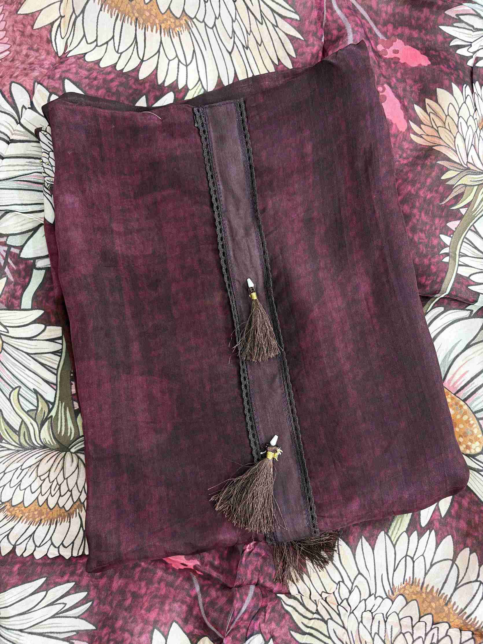 Close-up of digitally printed multicolor big sunflower motifs on deep wine silk organza shirt hemline