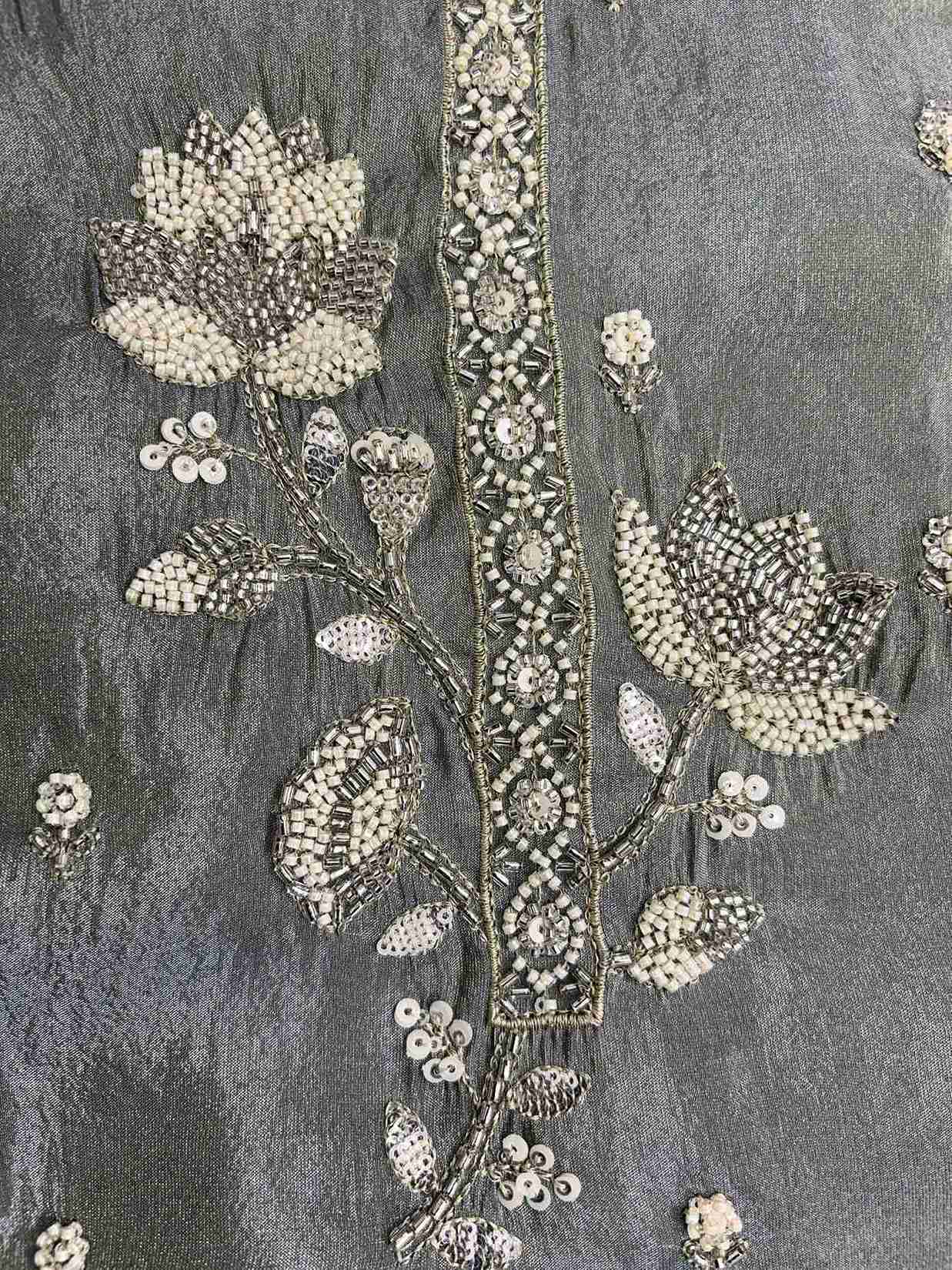 handwork detail on sage green suit