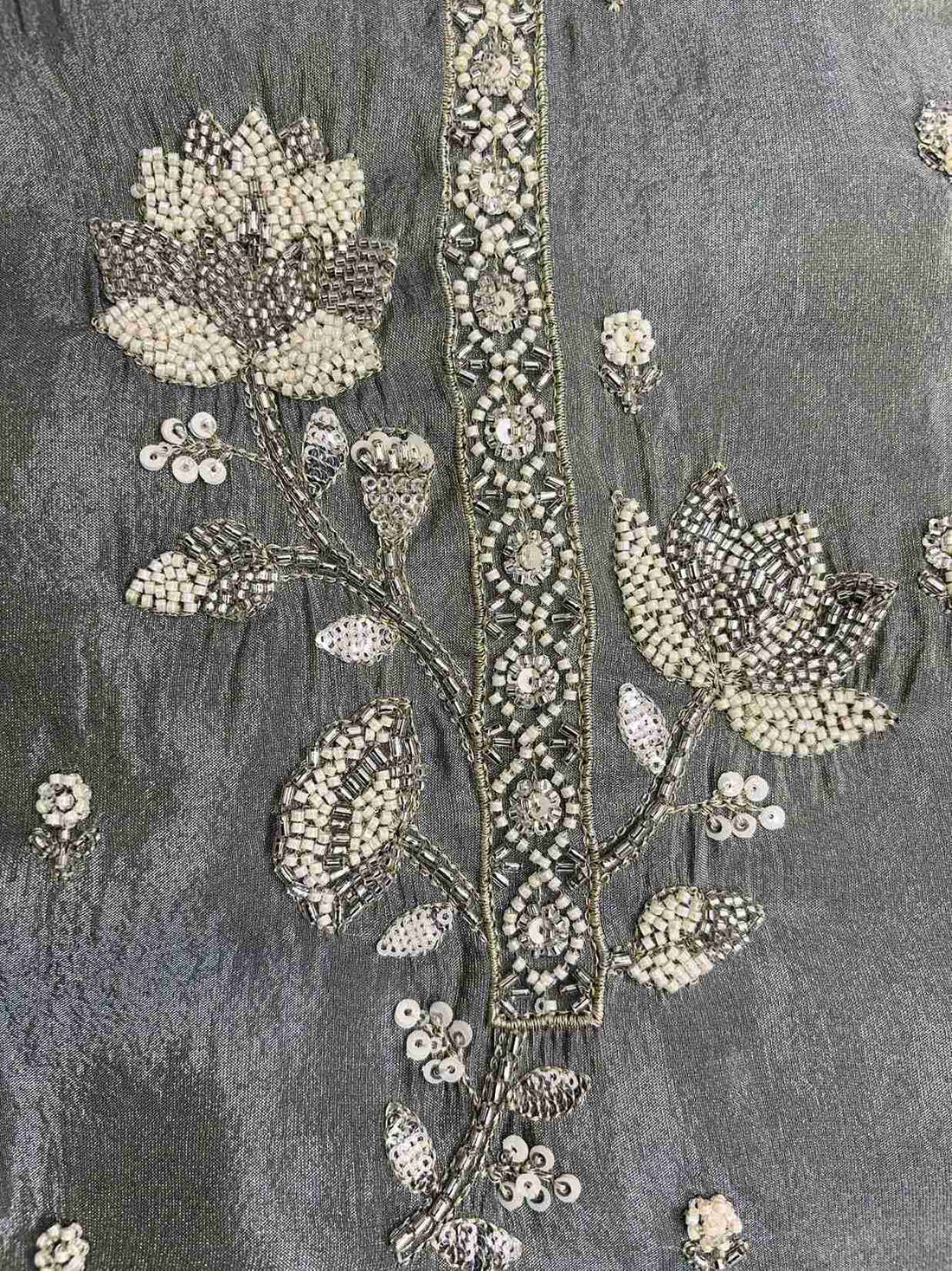 handwork detail on sage green suit