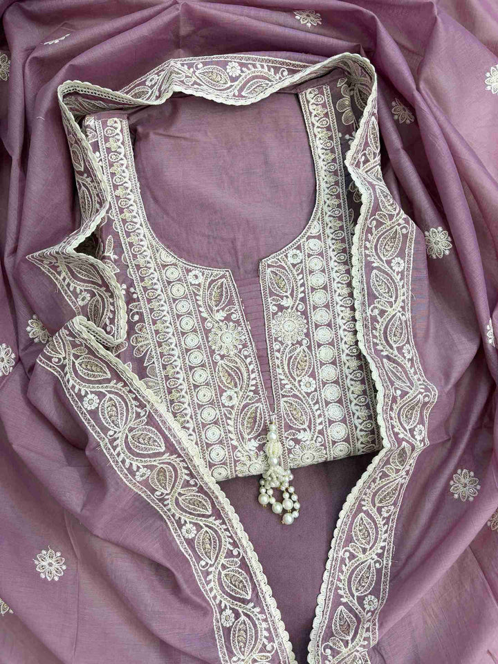 dusted mauve mul chanderi suit with white resham embroidery and tassel neckline front view