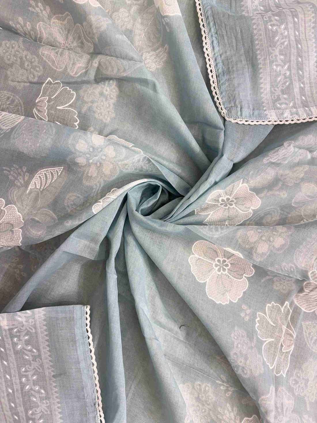 All-over white floral digital print with white lace border finishing on dusty blue cotton dupatta
