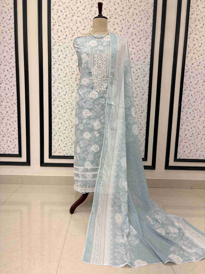 Dusty Blue cotton unstitched suit full front view with floral printed dupatta with lace border draped on mannequin