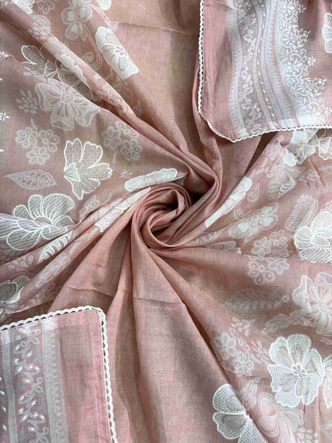 All-over white floral digital print with white lace border finishing on dusty pink cotton dupatta