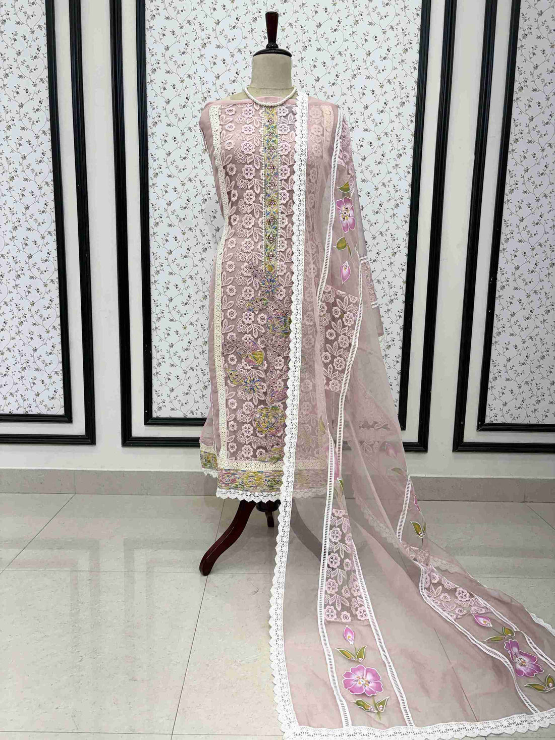 Dusty pink organza unstitched suit full front view with hand-painted floral dupatta draped on mannequin