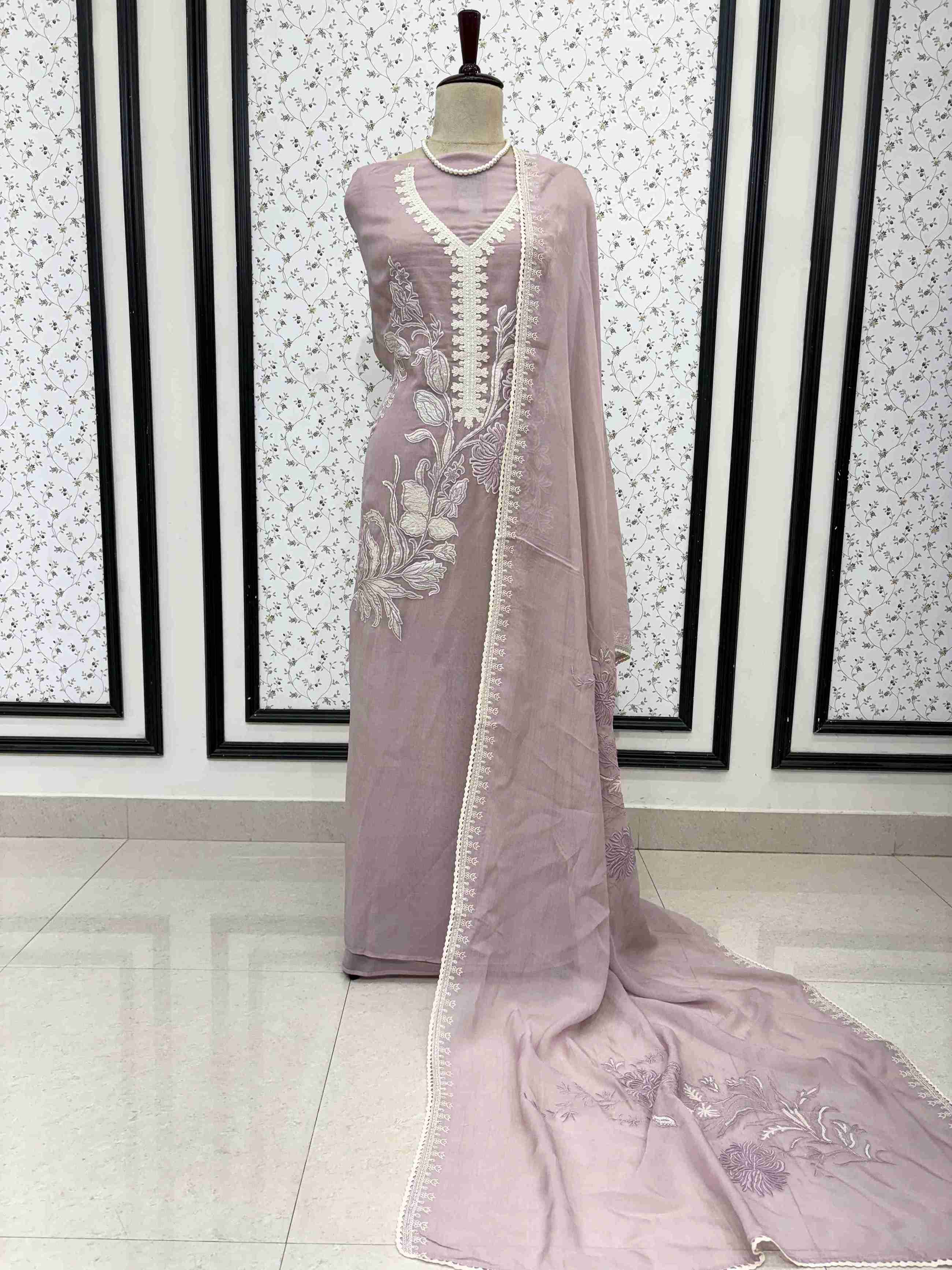 Dusty rose mauve mul cotton unstitched suit full front view with matching applique dupatta draped on mannequin