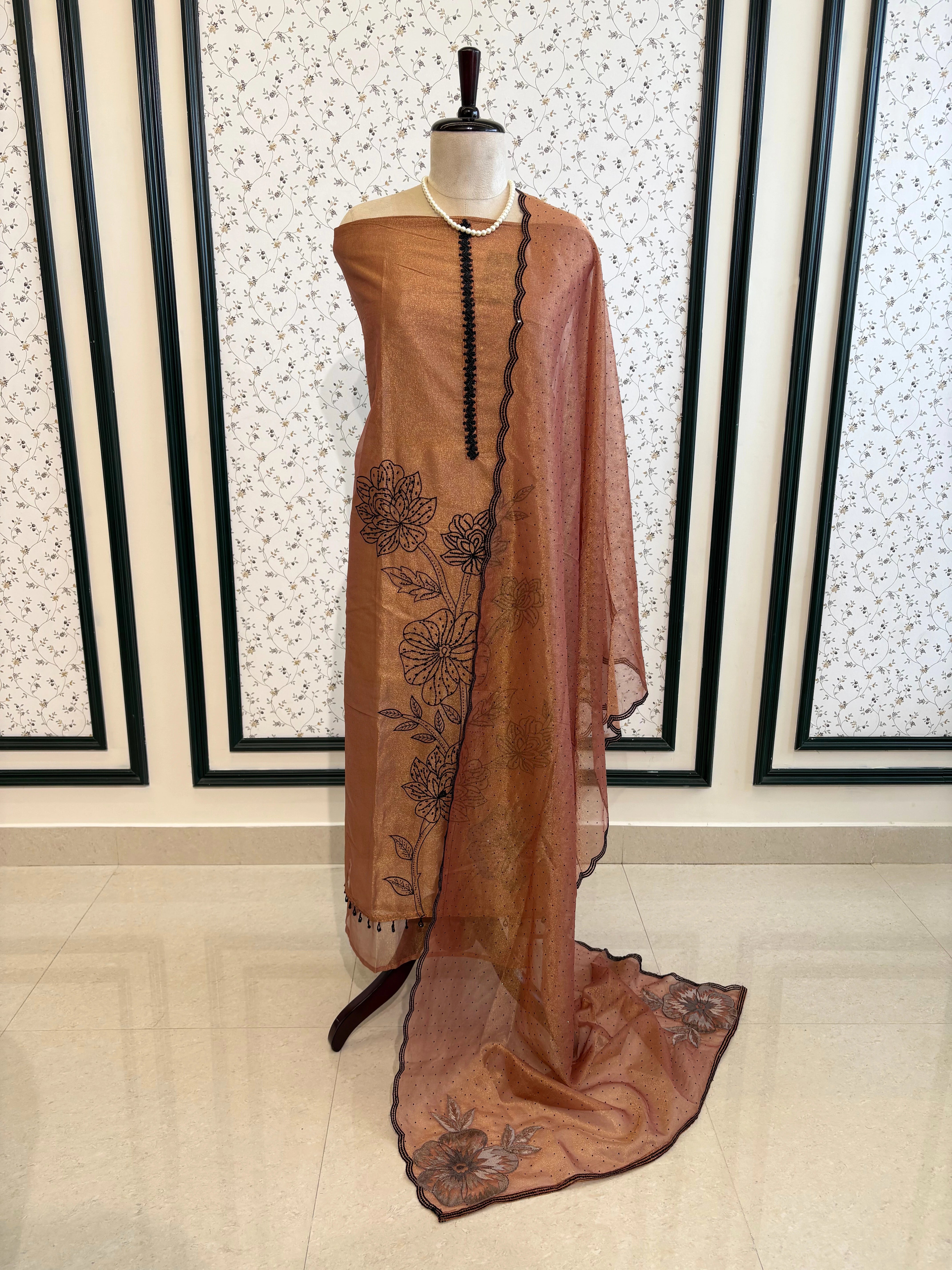 Rust glass tissue suit with intricate embroidery and organza dupatta – luxury ethnic wear for weddings and festive occasions.