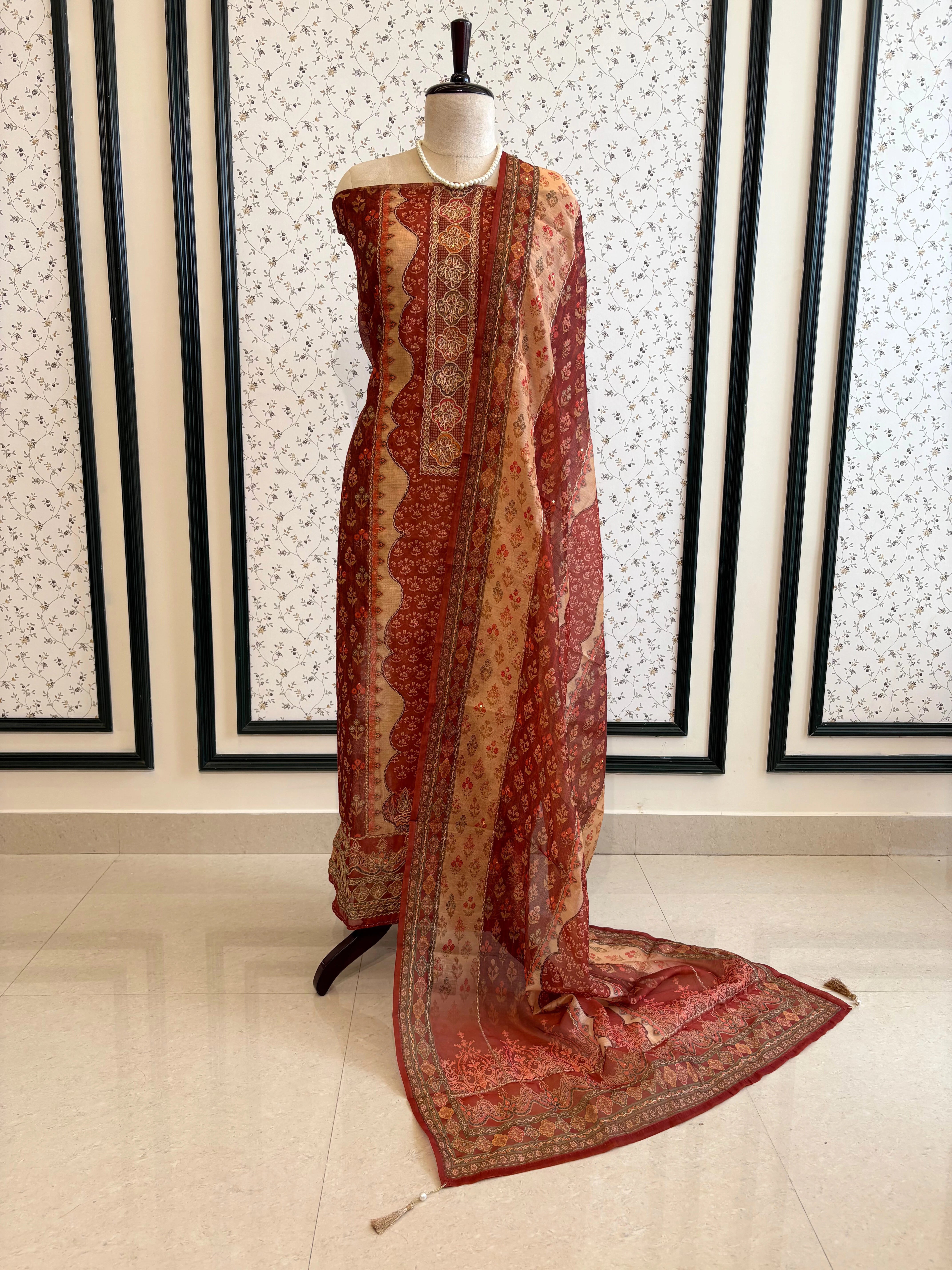 Rust red chanderi suit with golden weave and printed chanderi dupatta featuring tassel edging.