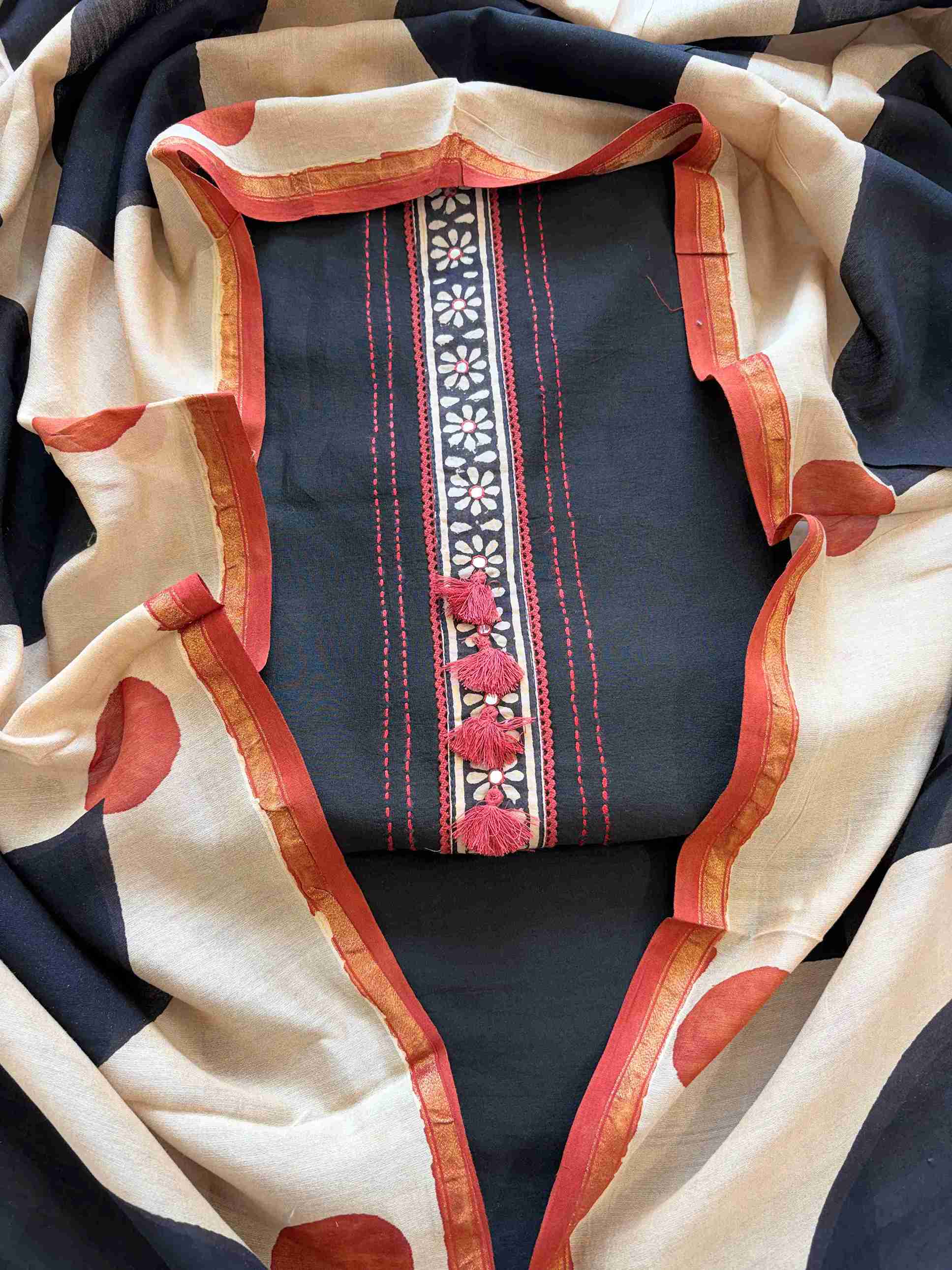 Black Maheshwari silk unstitched suit with tassel placket neckline and hand block printed dupatta