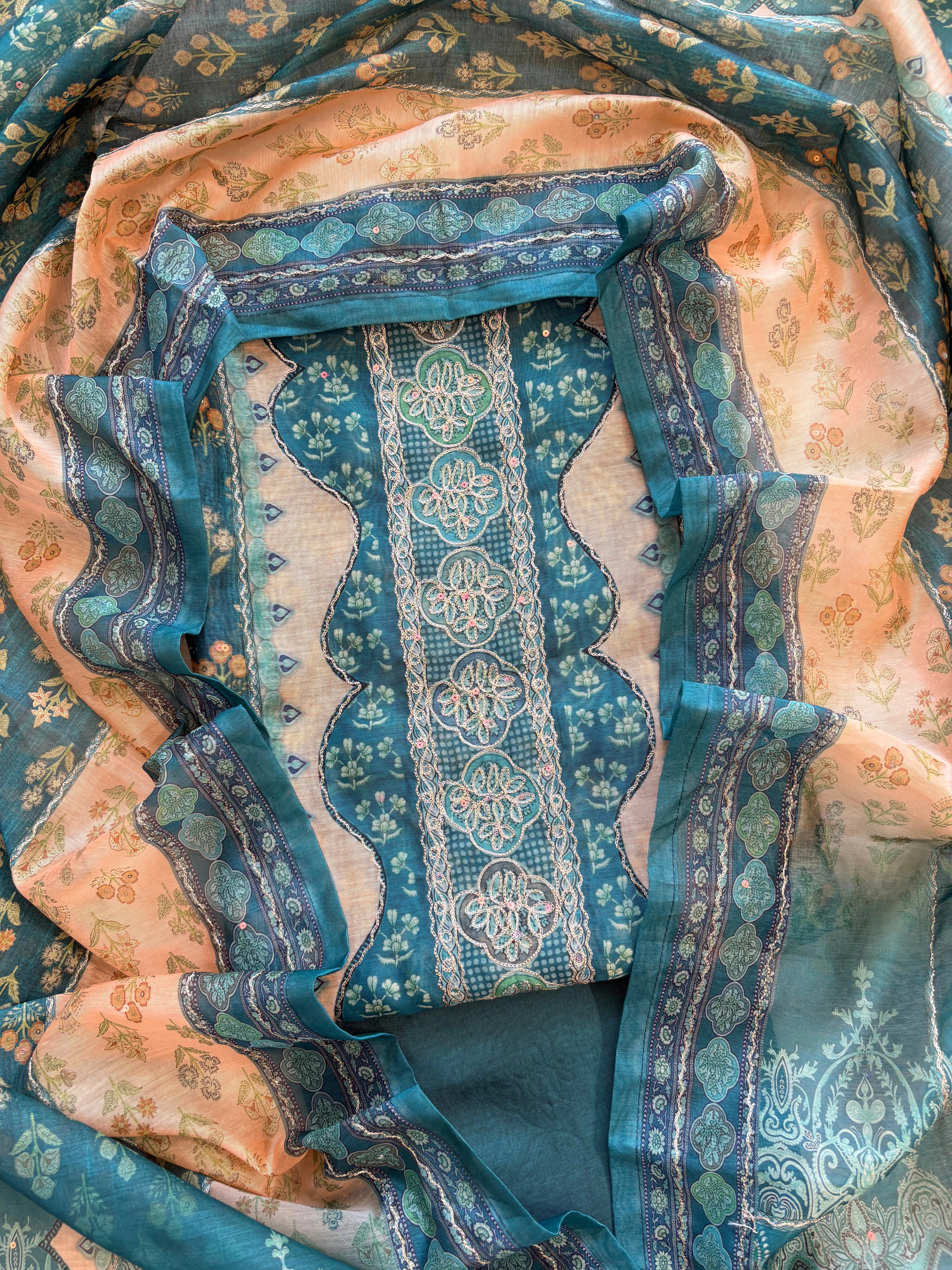 Teal green chanderi suit with golden weave and printed chanderi dupatta featuring tassel edging.