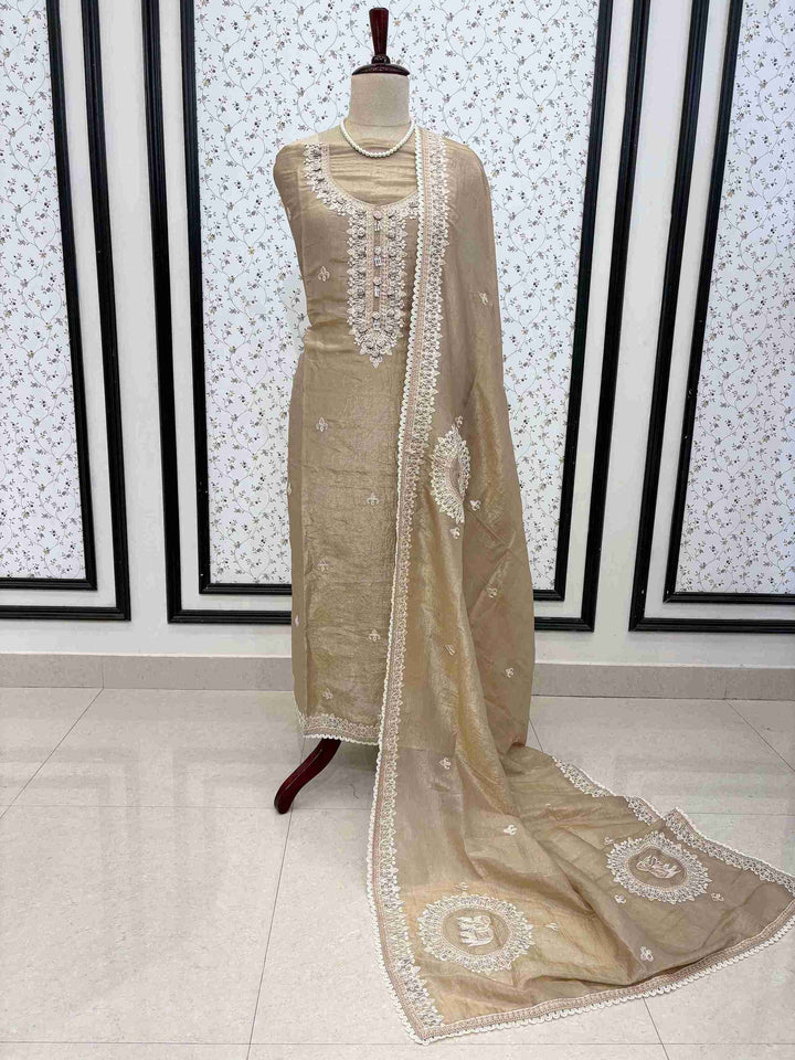 Elegant beige tissue unstitched suit set with opada silk bottom