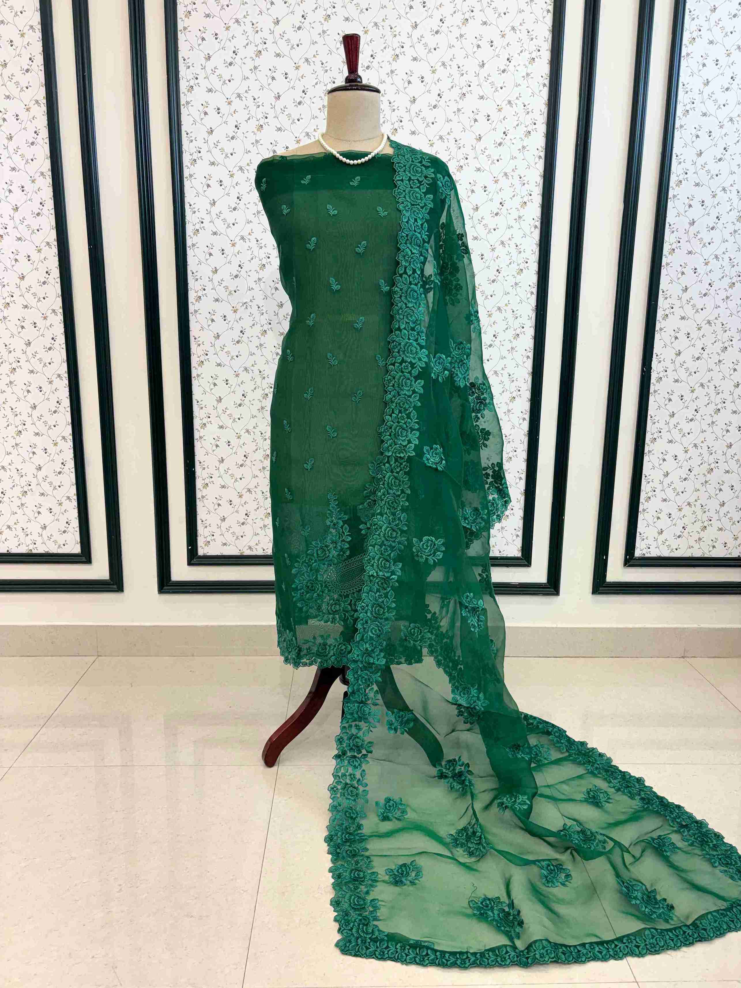 Complete emerald green designer glass tissue unstitched suit set display