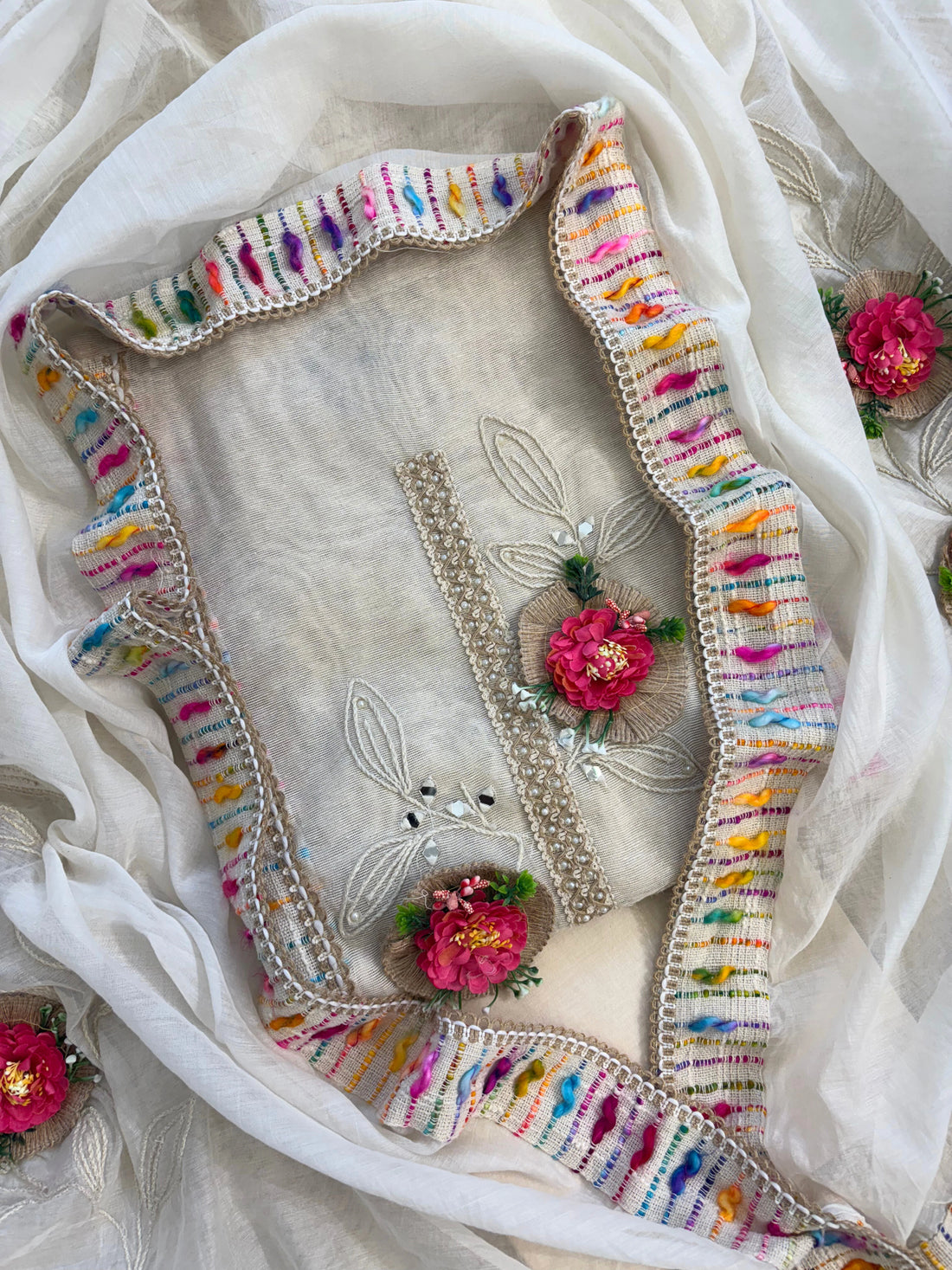 Ivory jute cotton suit with 3D floral embellishments and embroidered dupatta with multicolor thread border.