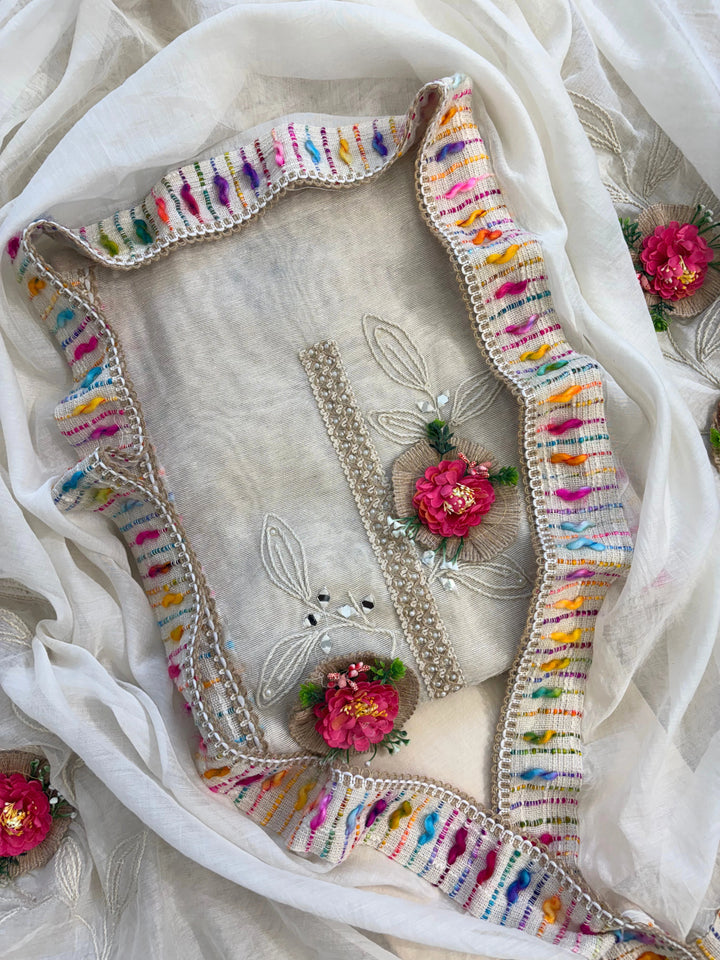 Ivory jute cotton suit with 3D floral embellishments and embroidered dupatta with multicolor thread border.
