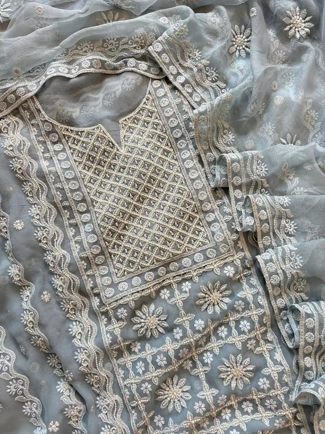 Powder blue georgette suit with moti highlighting and chiffon dupatta – embroidered festive ethnic wear for weddings and formal occasions.