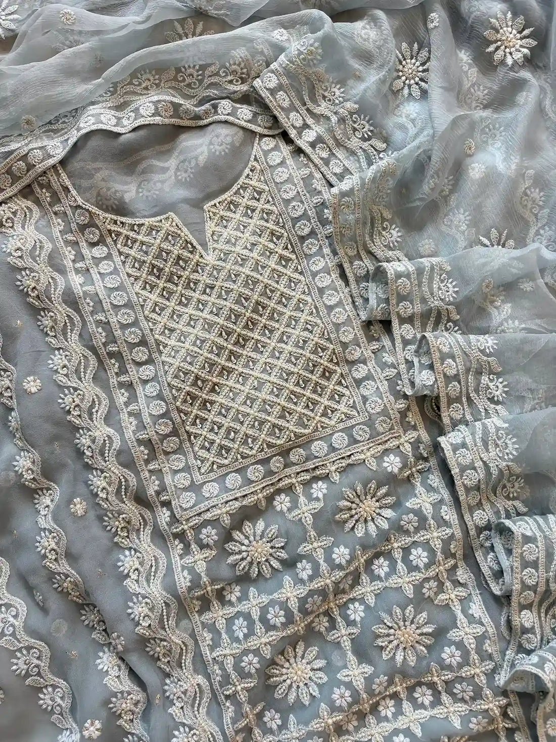 Powder blue georgette suit with moti highlighting and chiffon dupatta – embroidered festive ethnic wear for weddings and formal occasions.