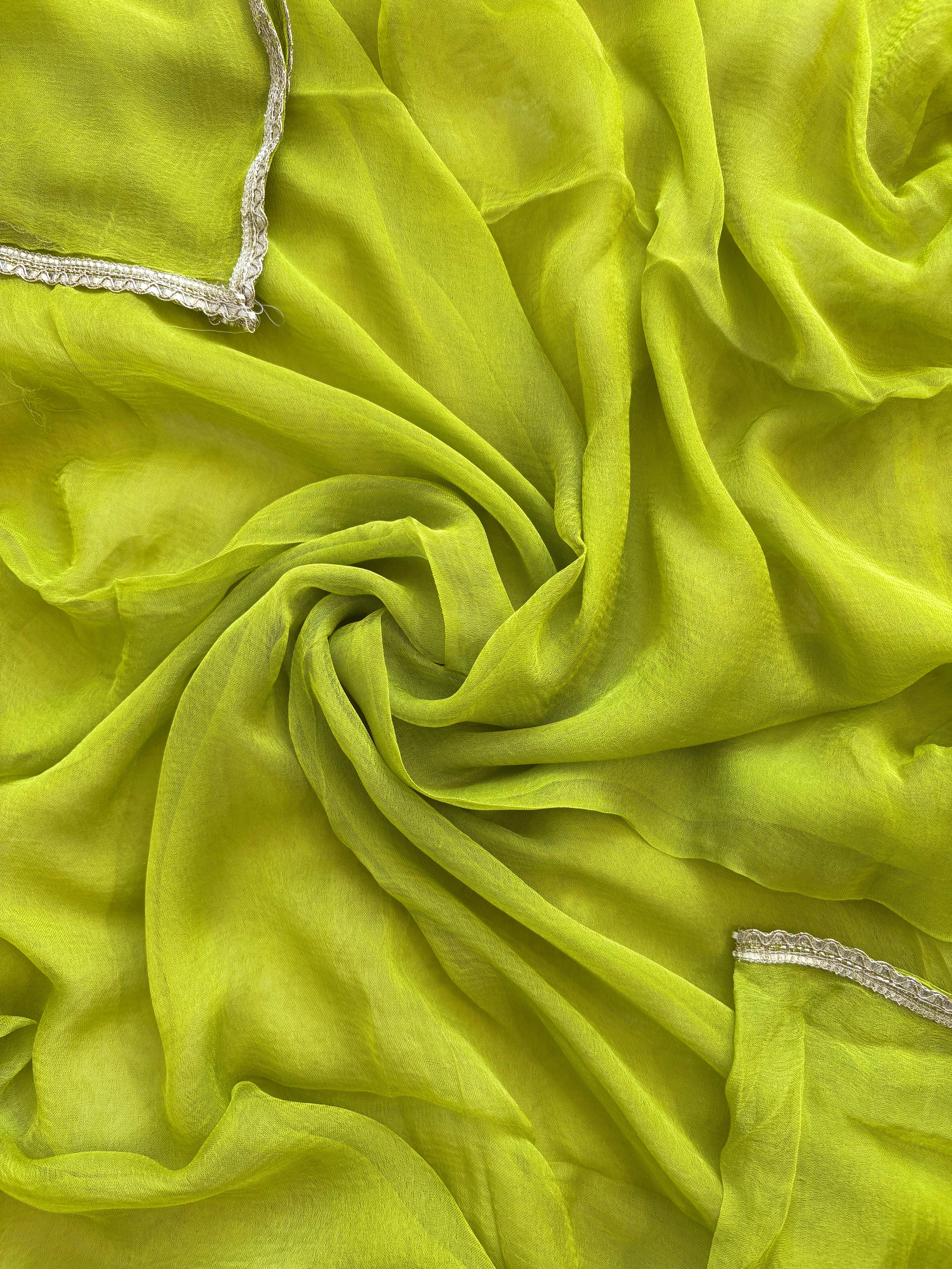 Lime Green Shimmer organza bandhani suit with ombre effect and chiffon dupatta with lace border.