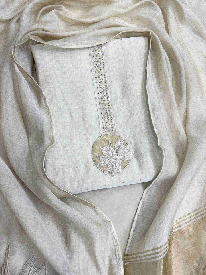 flat lay of jaamdani suit with floral applique highlight
