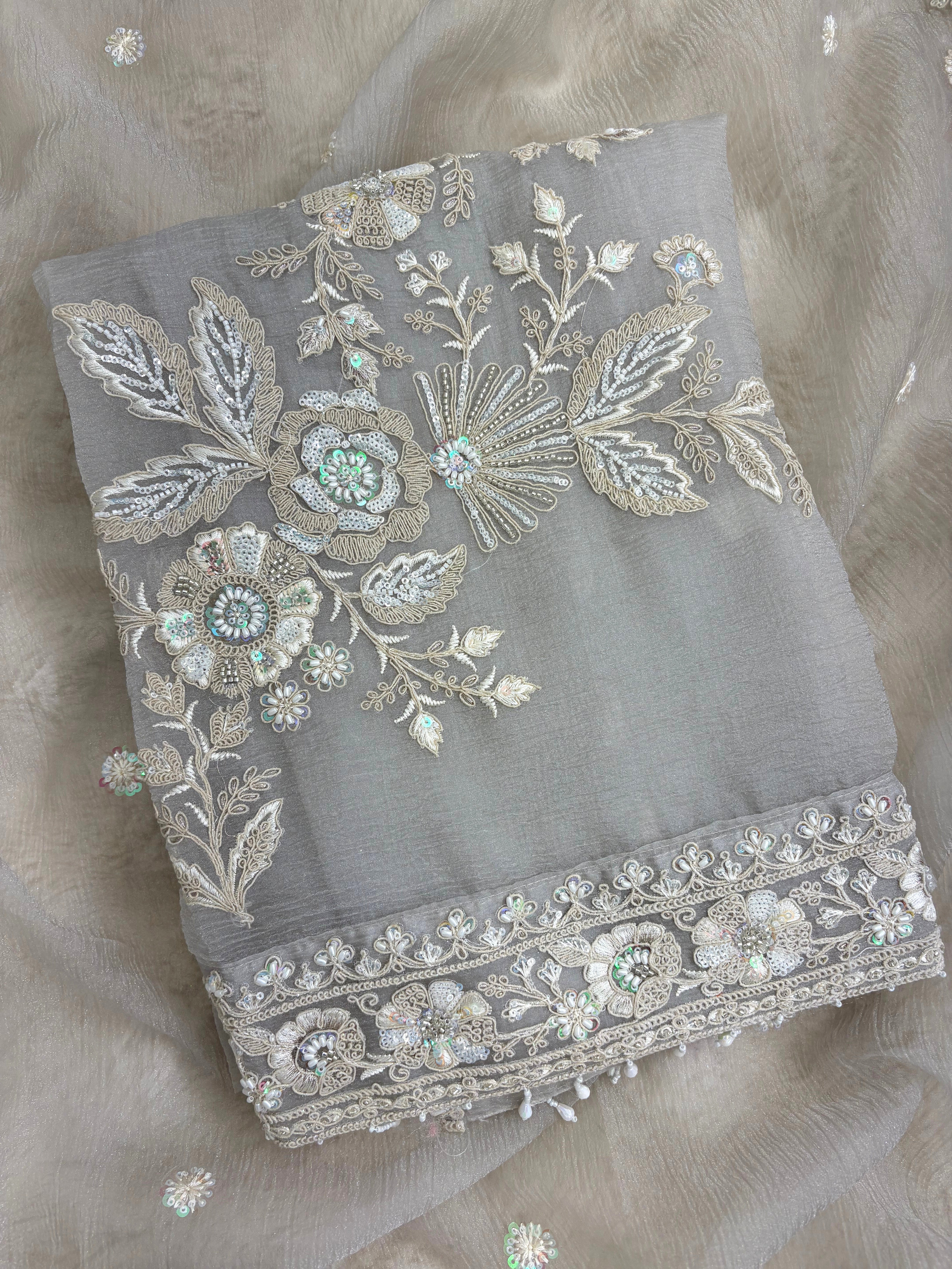 Embroidered shirt border finished with decorative latkans