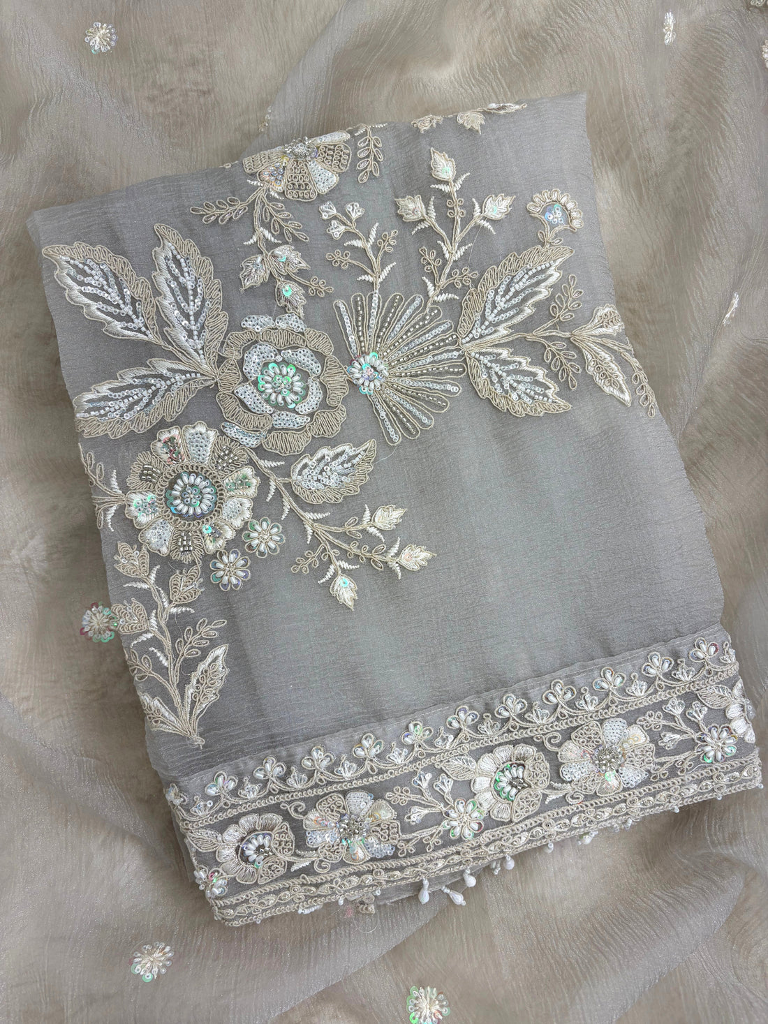 Embroidered shirt border finished with decorative latkans