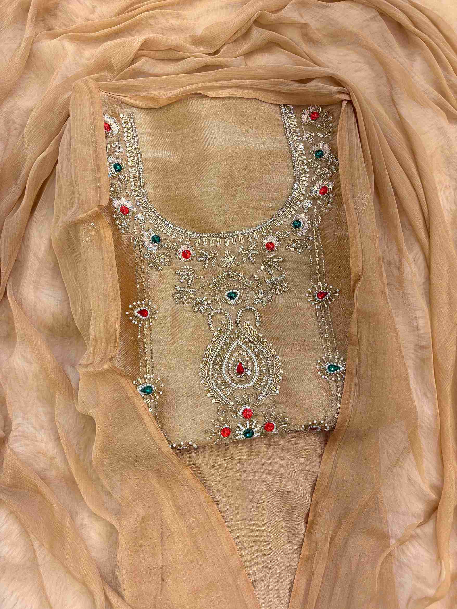 Close-up of zardozi embellished neckline with beads, moti and gemstones