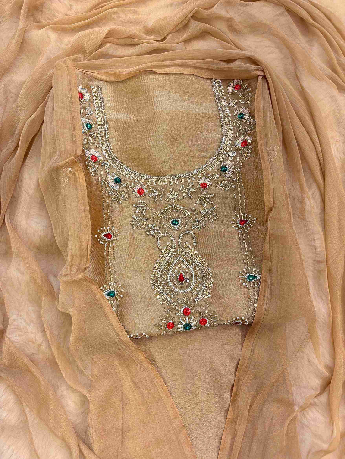 Close-up of zardozi embellished neckline with beads, moti and gemstones