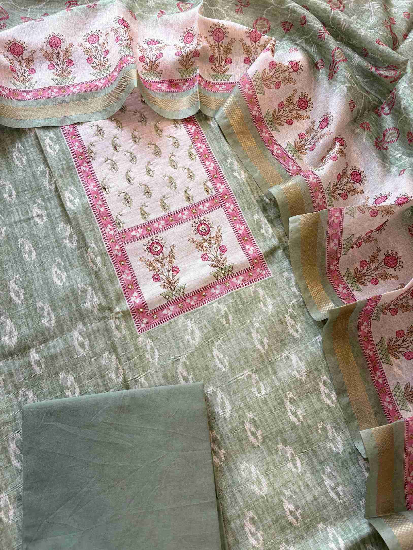 Floral motif print border on the hemline of green Chanderi suit