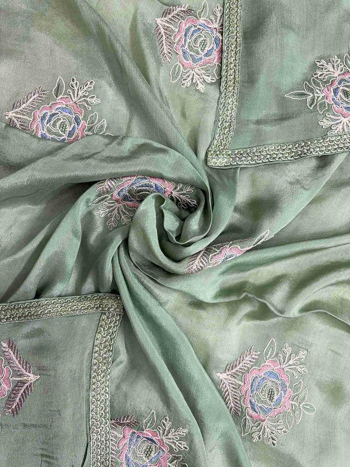 Lace-finished hemline detail on green chiffon dupatta