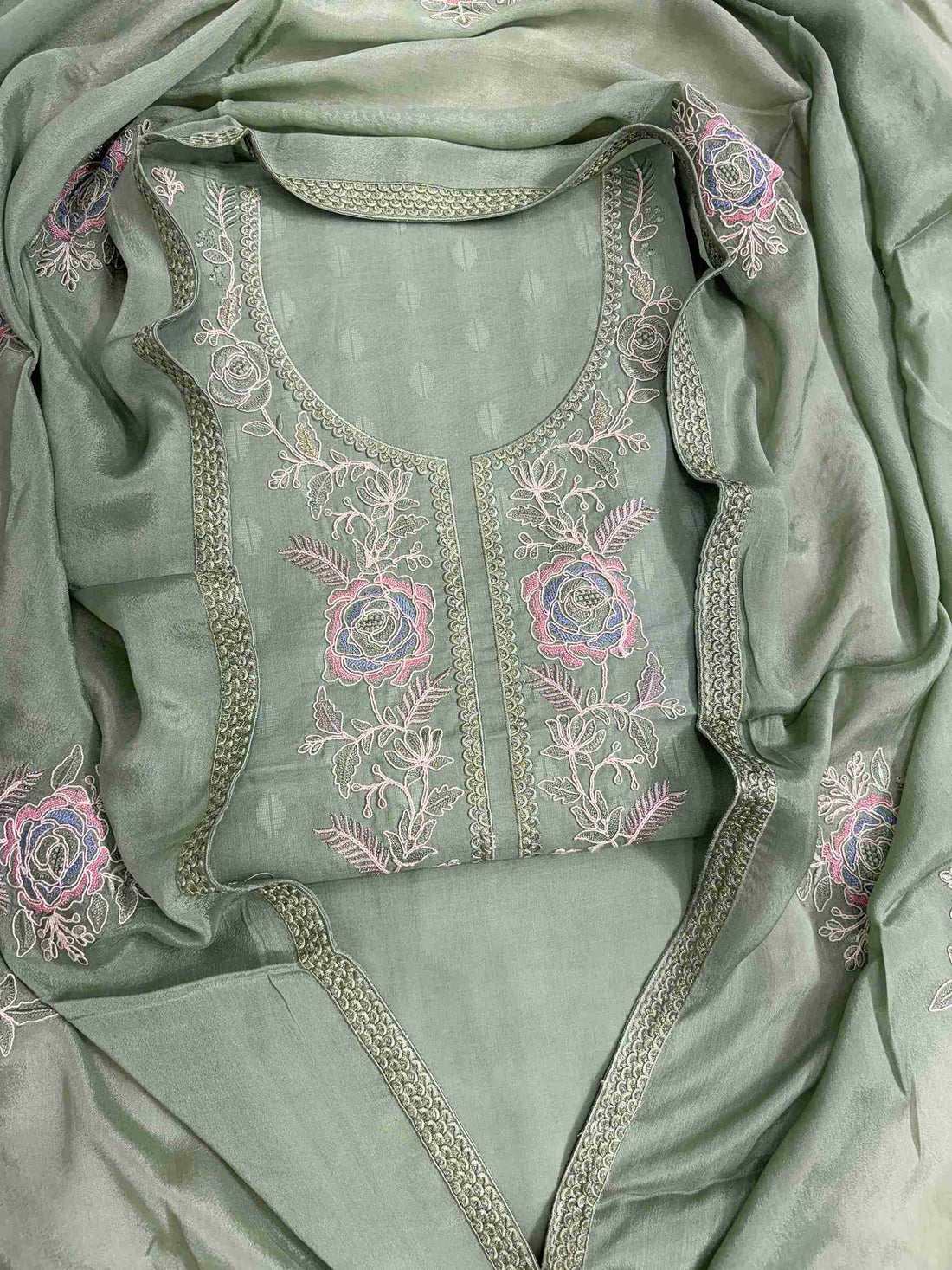 Green cotton unstitched suit with floral embroidered neckline flatlay