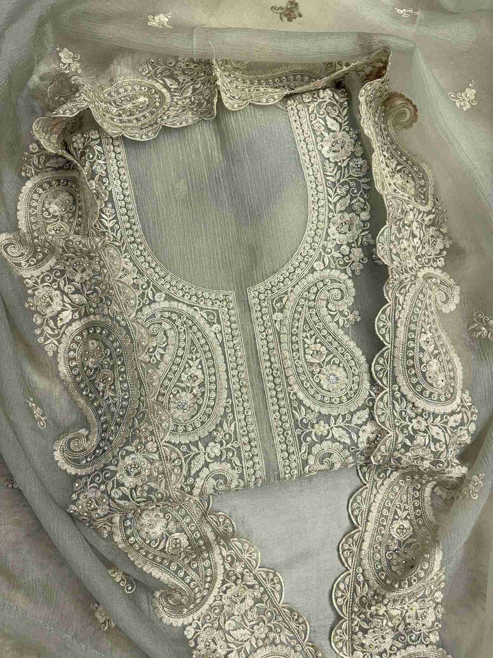 Close-up of intricate paisley neckline with cutdana, sequins, and pearl embellishments on Green marble chiffon shirt