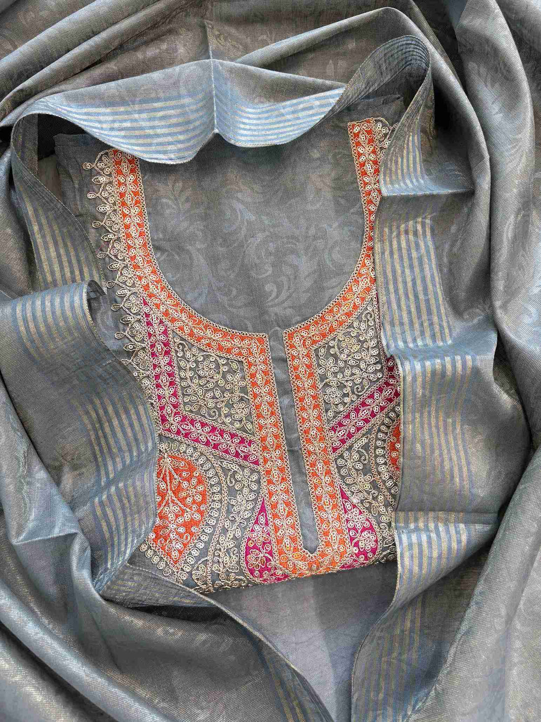 Grey tissue unstitched suit with hand embroidered neckline and tissue dupatta