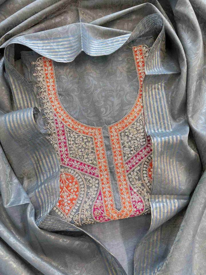 Grey tissue unstitched suit with hand embroidered neckline and tissue dupatta