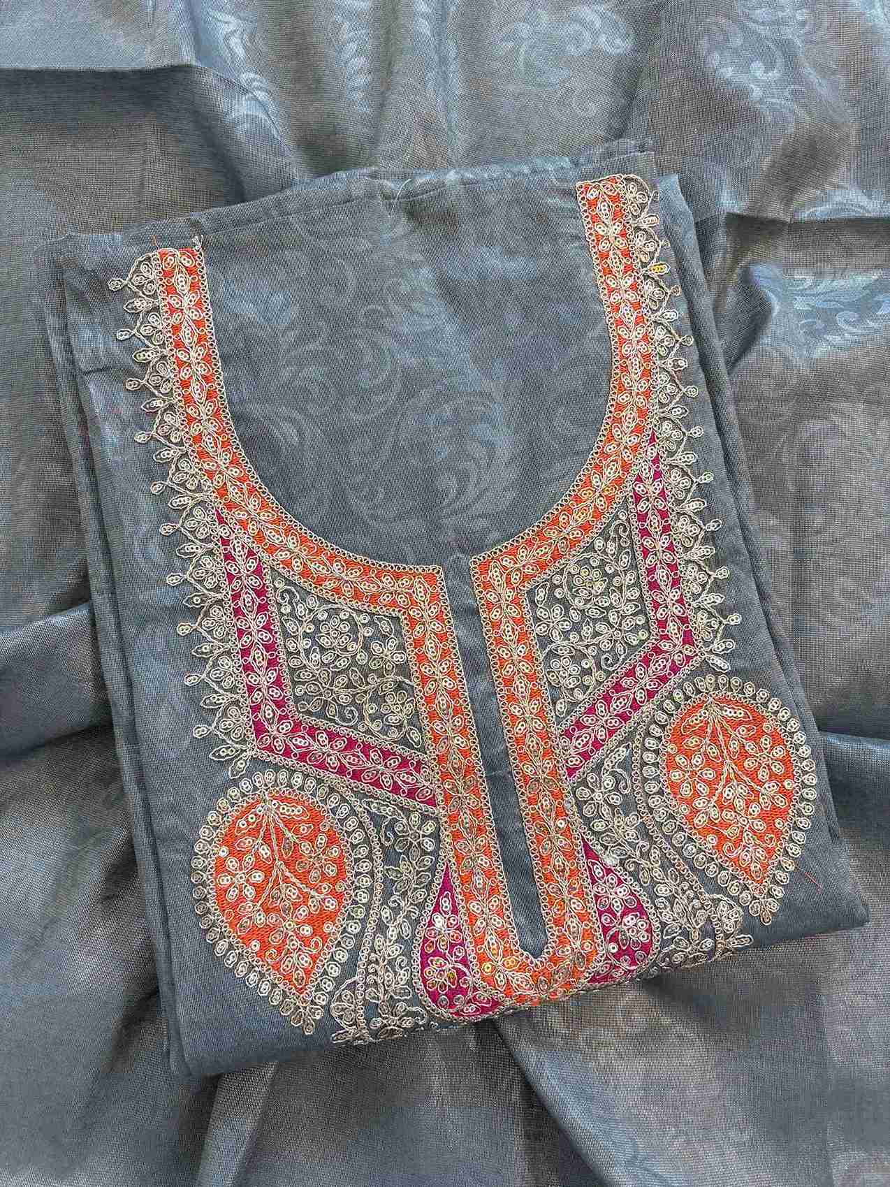 Close-up of contrast hand embroidery on cream tissue chikankari style suit