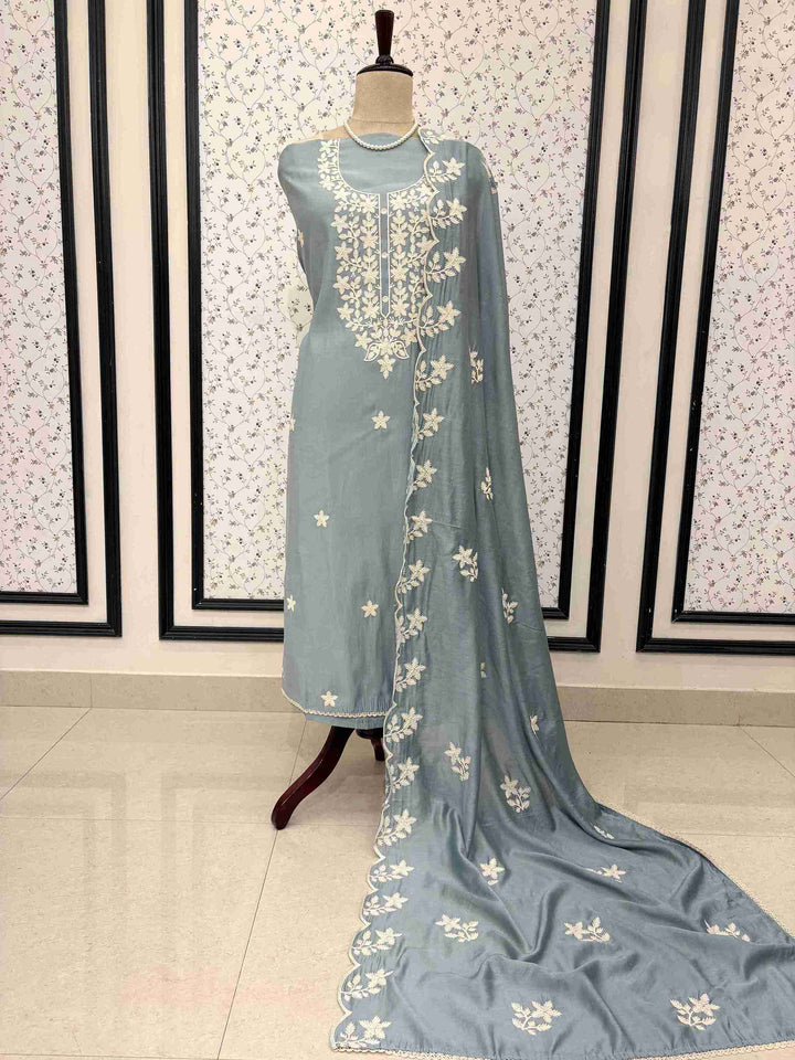 Greyish blue jaam cotton unstitched suit full front view with crotia embroidered dupatta draped on mannequin