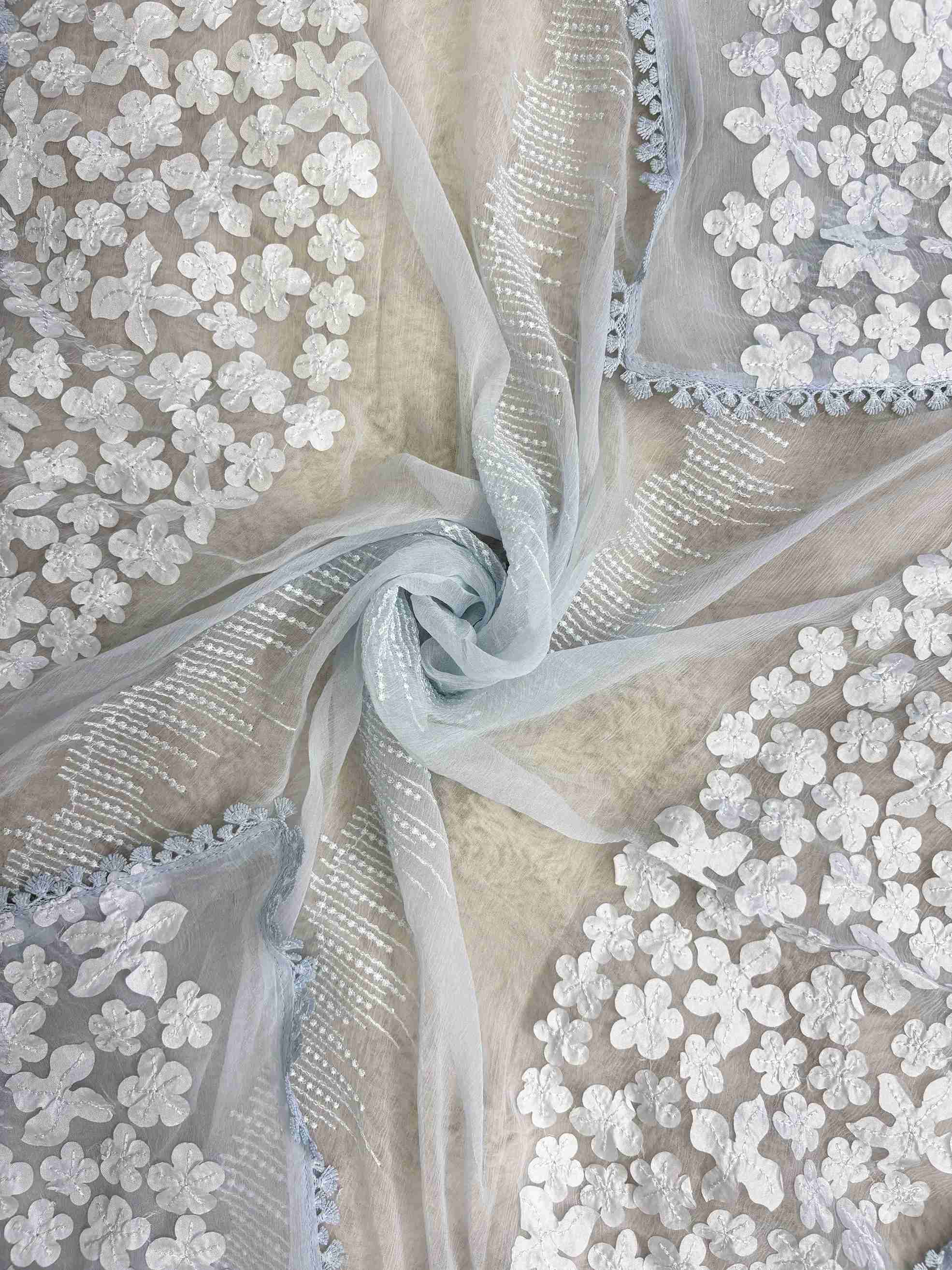 White floral applique on longer sides and four-sided lace finishing on ice blue chiffon dupatta
