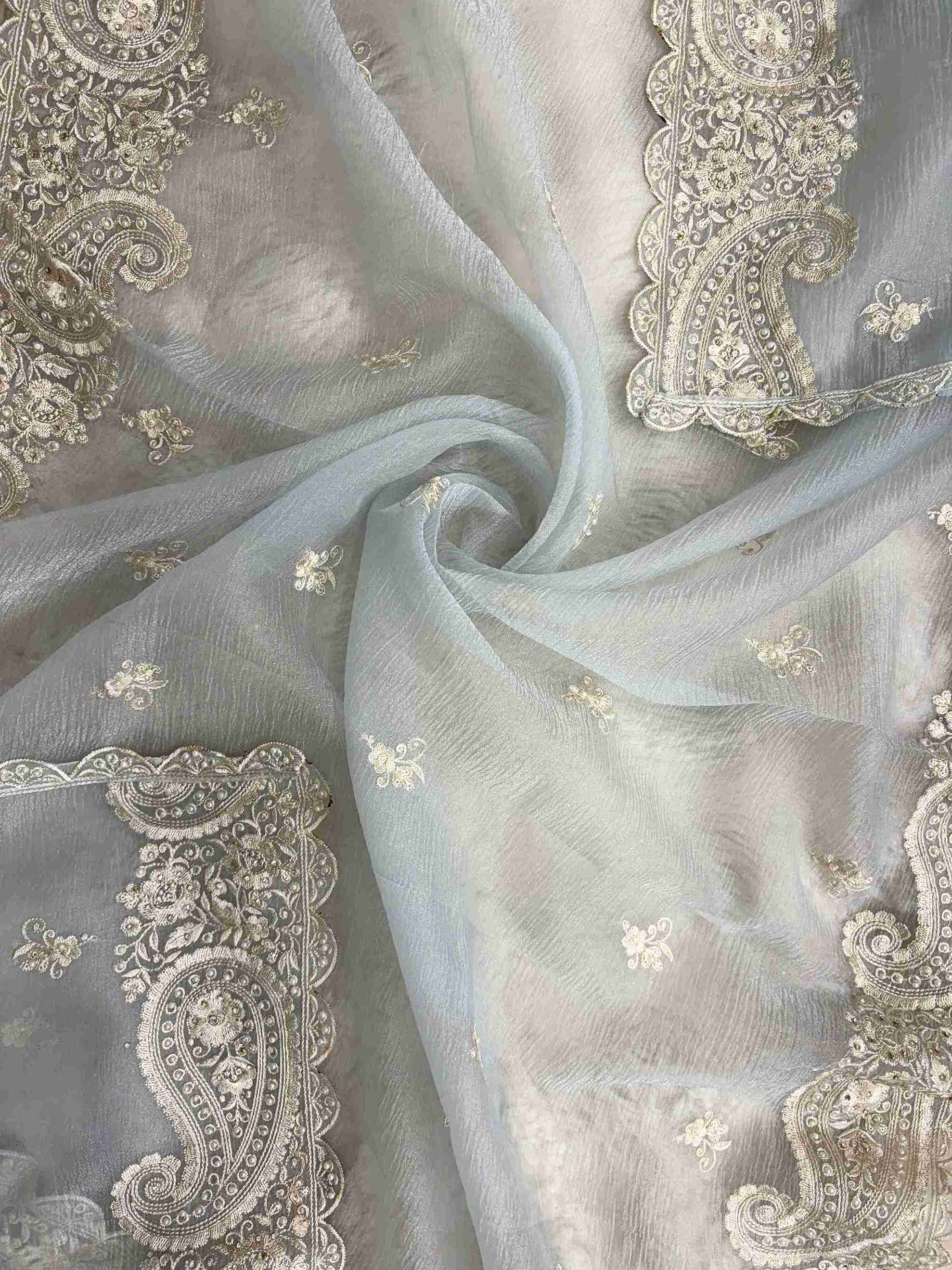 Paisley cutwork border with scalloped finishing along ice blue marble chiffon dupatta edge