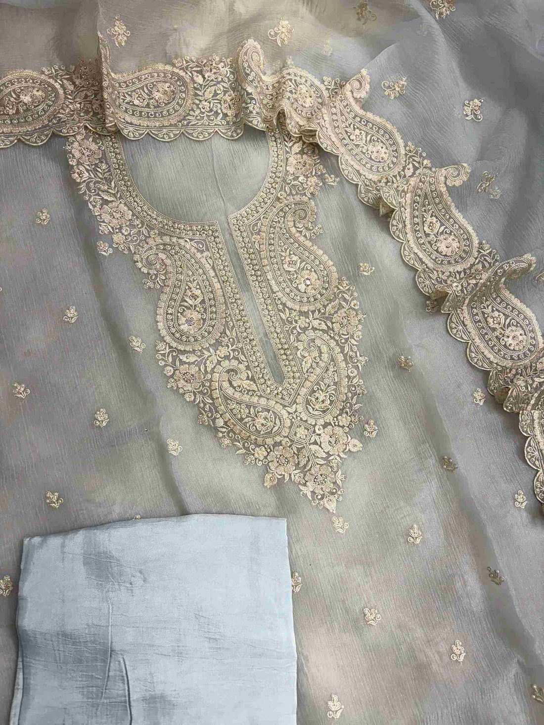 Complete ice blue marble chiffon unstitched suit flat lay set with shirt, dupatta, and opada silk bottom