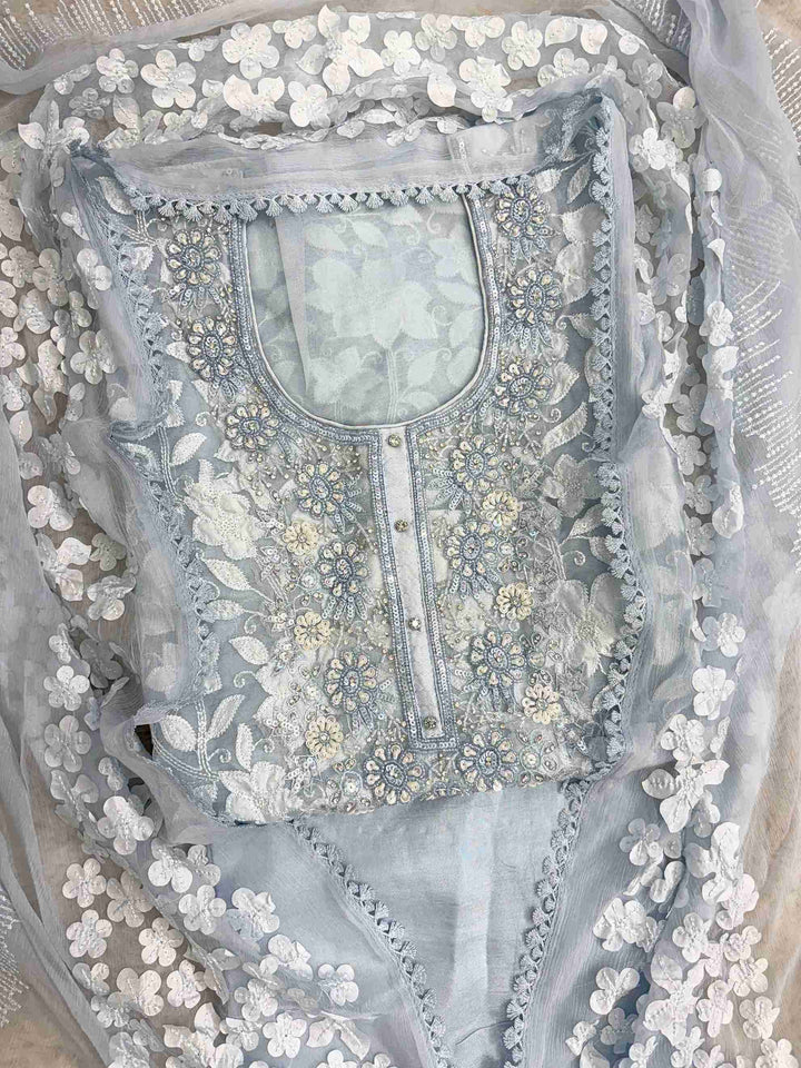 Heavily embellished sequin, moti, and bead neckline detail on ice blue organza unstitched shirt