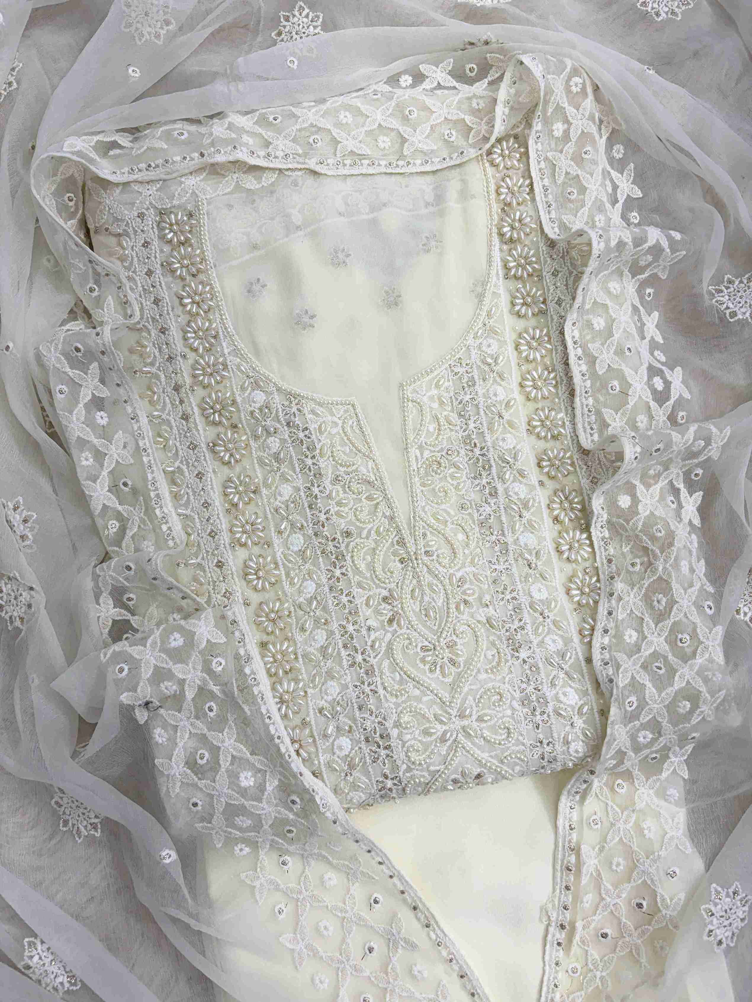 Ivory suit neckline with moti beads and sequence embellishment