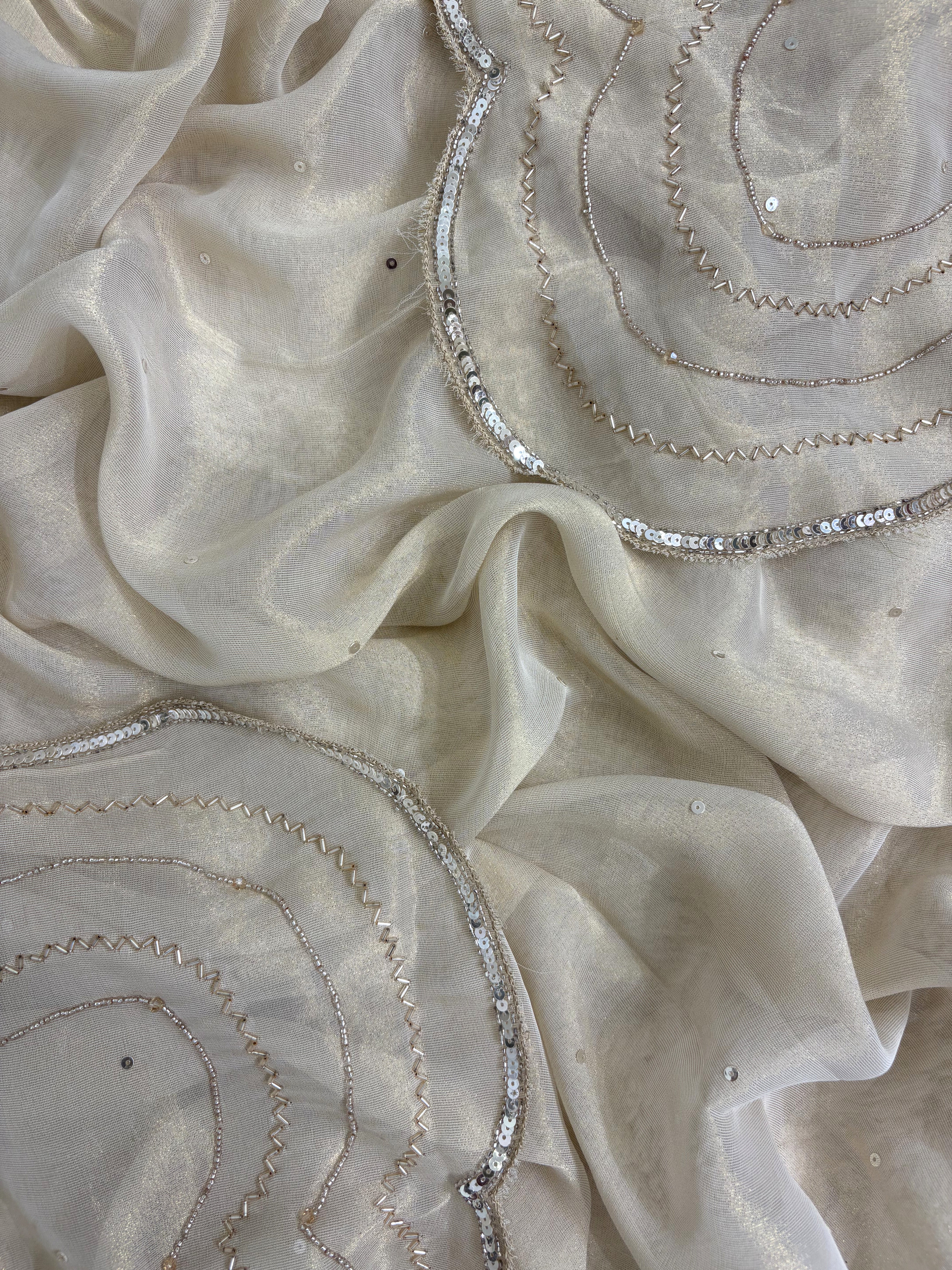 Ivory shimmer tissue dupatta with sequence and moti border detailing