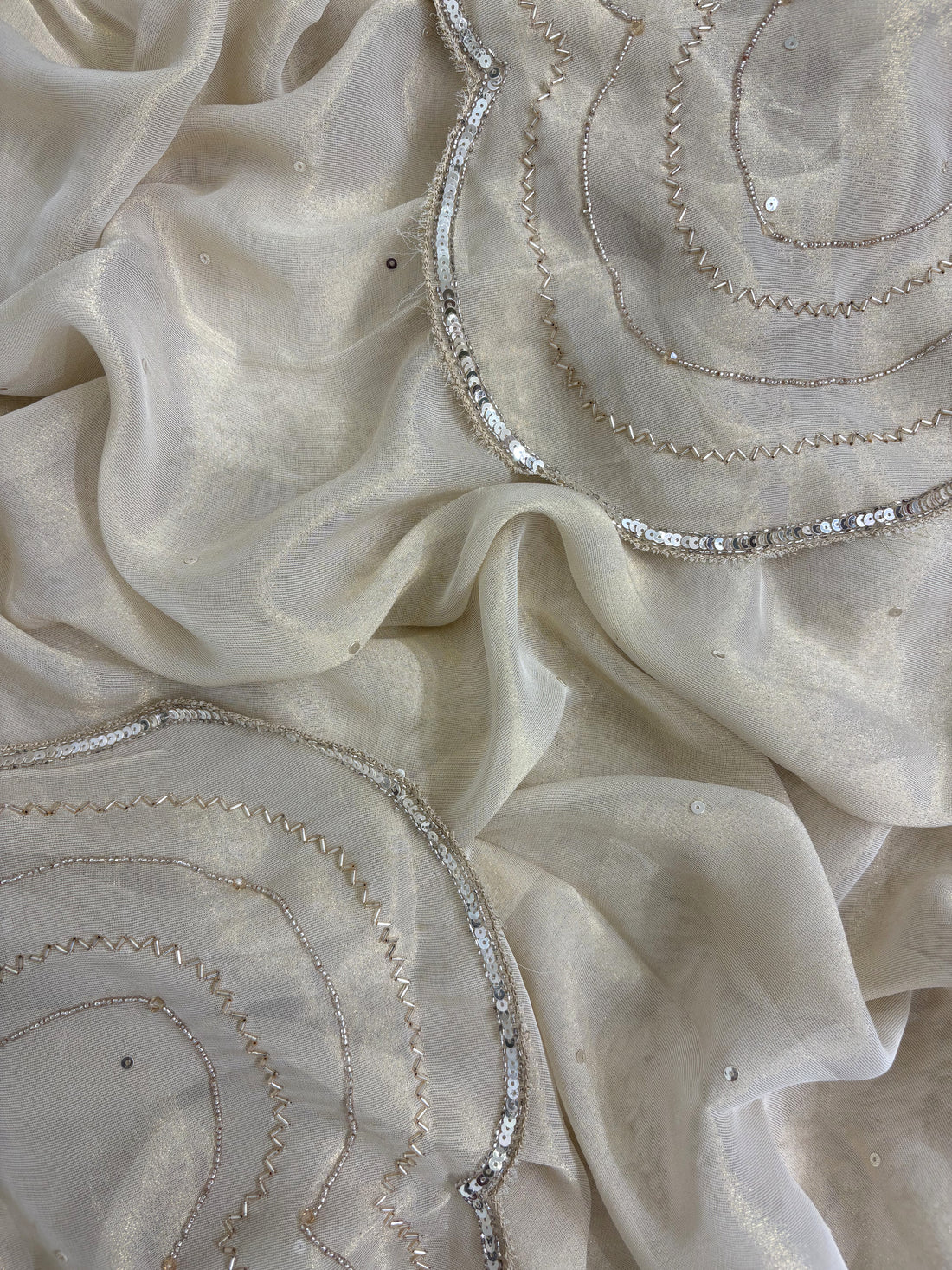 Ivory shimmer tissue dupatta with sequence and moti border detailing