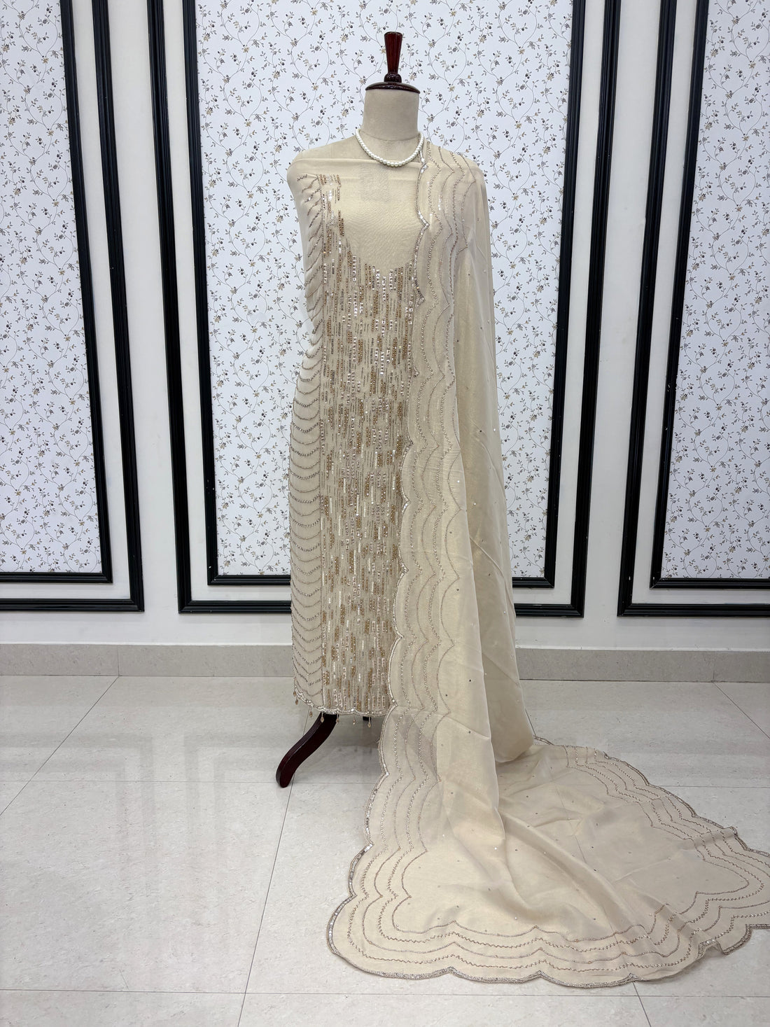 Elegant display of ivory heavy embroidered wedding wear suit set