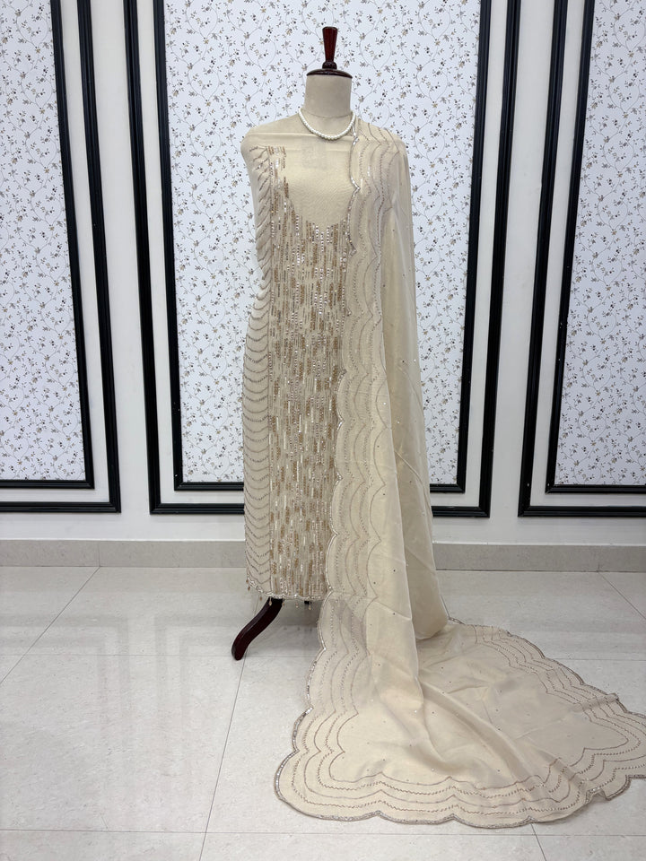 Elegant display of ivory heavy embroidered wedding wear suit set