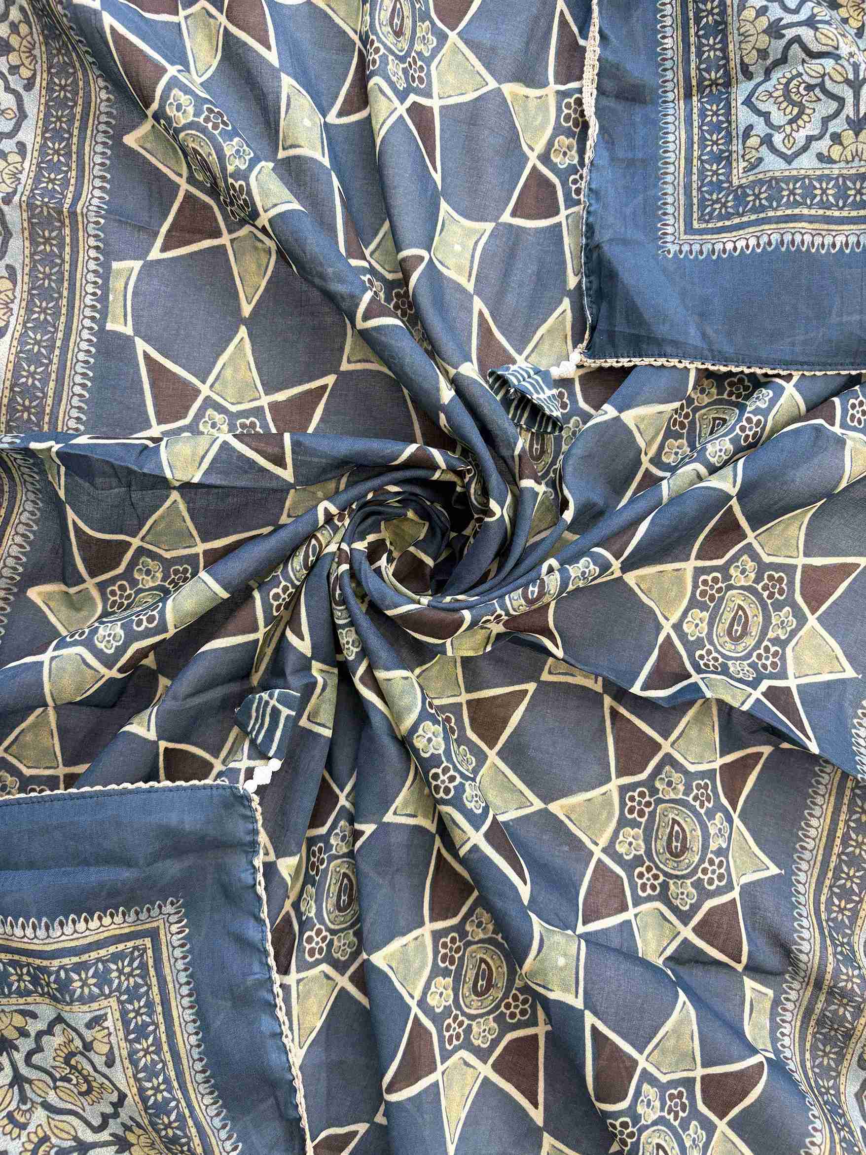 Large-scale digital geometric star print with coordinating borders and crotia lace edge on jade green cotton dupatta